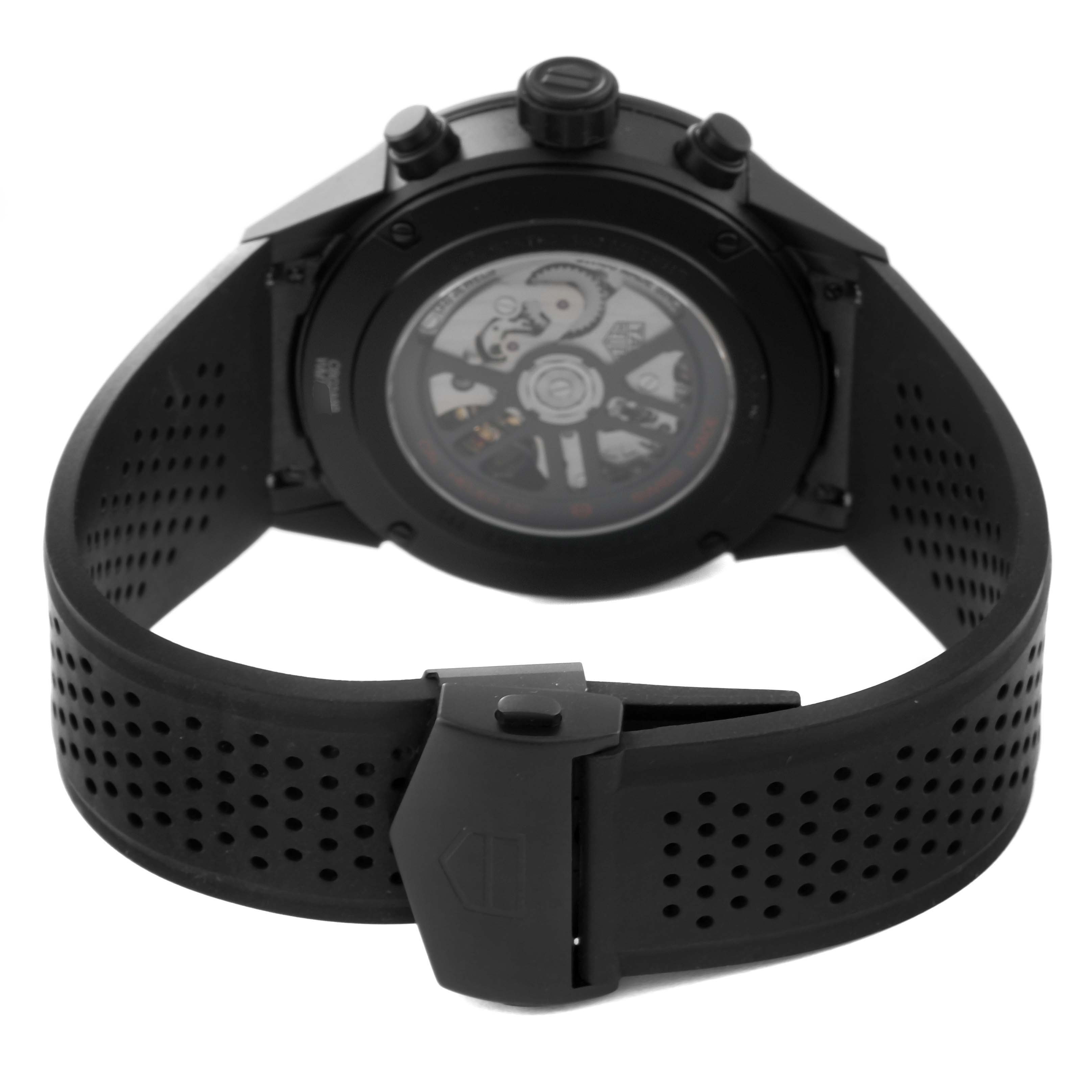 The image shows the back view of the Tag Heuer Carrera CBG2A90.BH0653 Men's Ceramic Black Dial CBG2A90.BH0653 Men's Ceramic Black Dial watch, highlighting the transparent case back and black perforated strap.