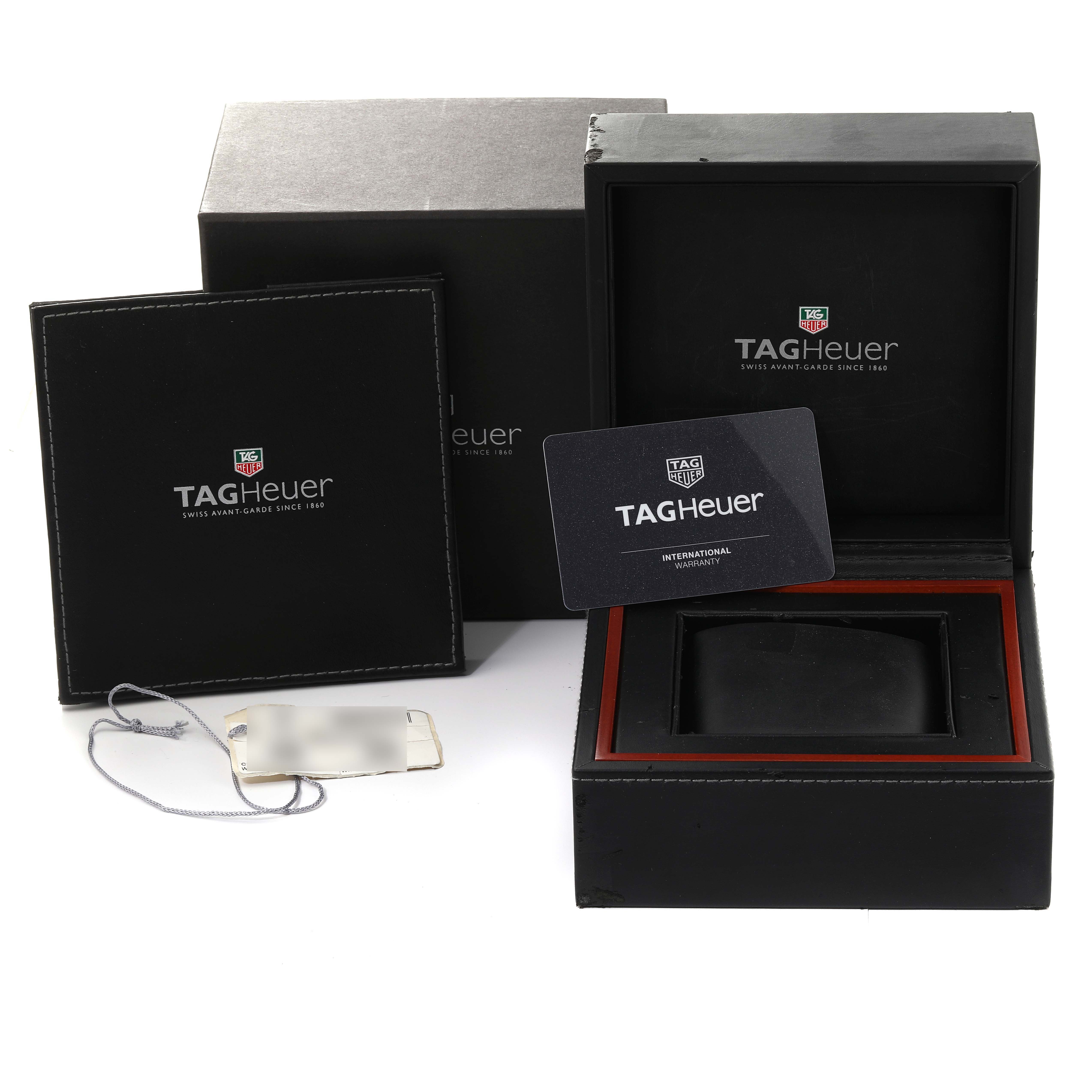 The image shows the packaging, international warranty card, and additional accessories for the Tag Heuer Carrera CBN2A5A.FC6481 Men's Steel and Gold (two tone) Black Dial CBN2A5A.FC6481 Men's Steel and Gold (two tone) Black Dial watch from a front angle.