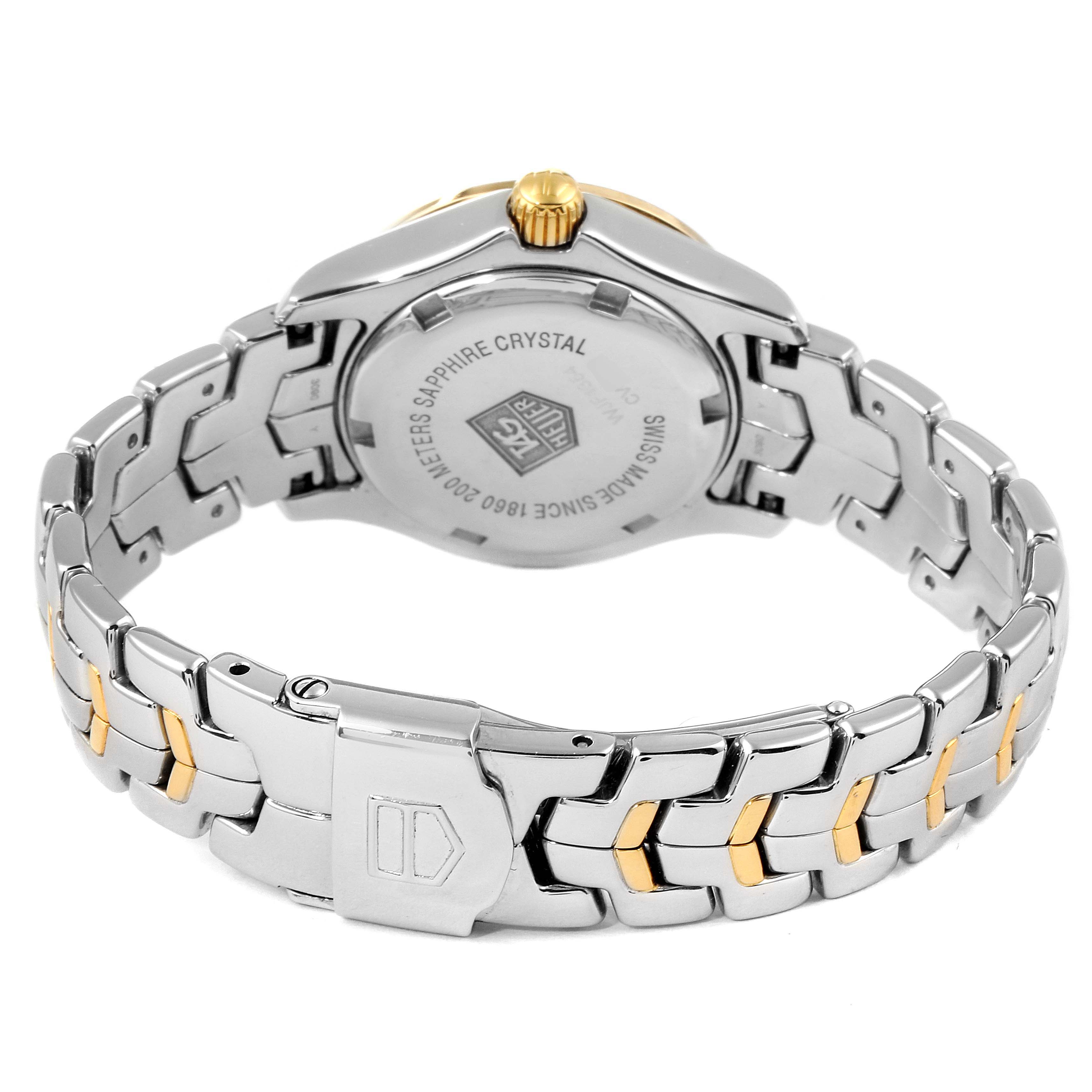 The image shows the back view of a Tag Heuer Link WJF1354.BB0581 Women
s Steel and Gold (two tone) Mother of Pearl Dial WJF1354.BB0581 Women
s Steel and Gold (two tone) Mother of Pearl Dial model watch, highlighting its bracelet and case back.