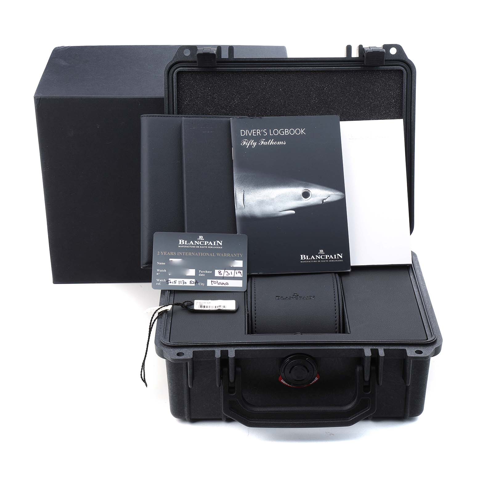The image shows accessories for a Blancpain Fifty Fathoms 5015-1130-52A Men's Stainless Steel Black Dial, including a case, logbook, and warranty cards.