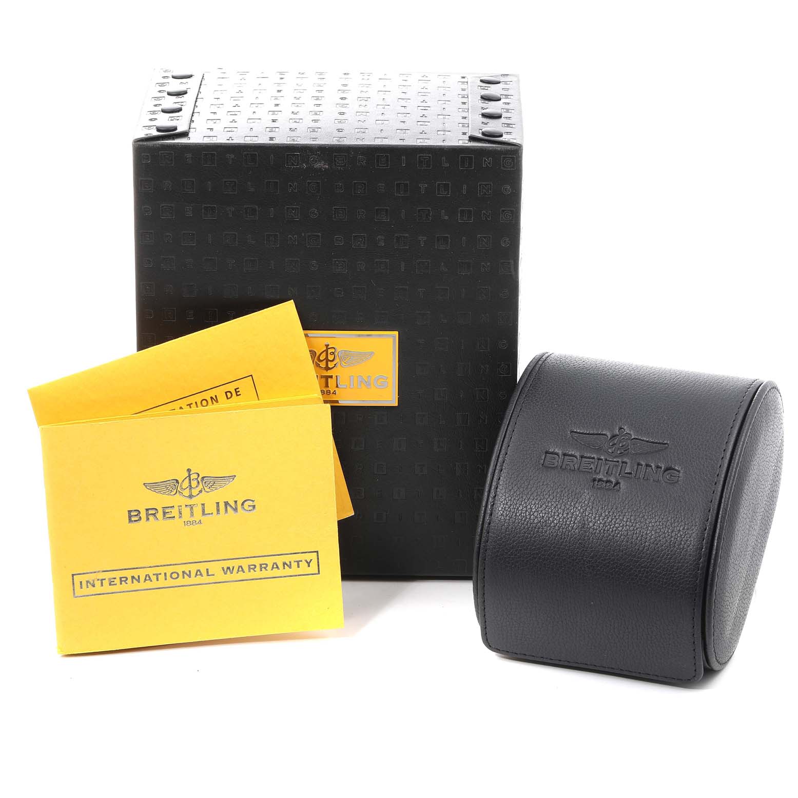 The image shows the packaging of a Breitling Avenger M73390 Men's Stainless Steel Black Dial M73390 Men's Stainless Steel Black Dial watch, including the watch box, warranty card, and leather case.