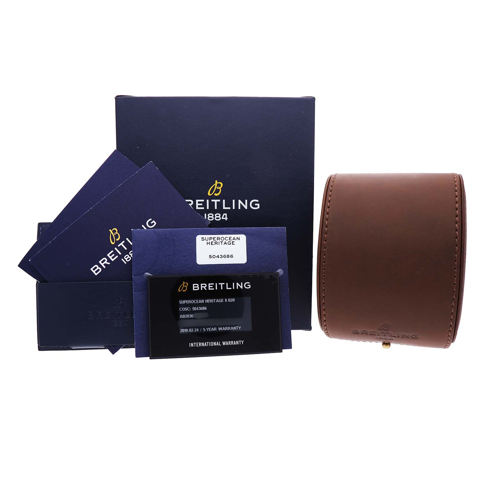 The image shows Breitling Superocean AB2030 Men's Stainless Steel Black Dial watch accessories, including warranty cards, a box, and a leather case, from a front angle.