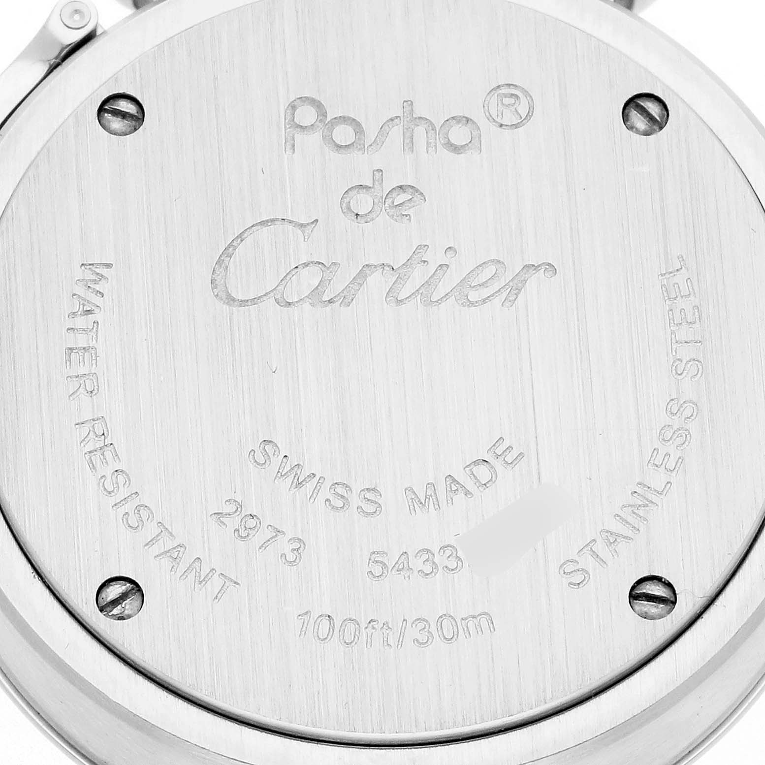 This image shows the case back of the Cartier Pasha W3140023 Women's Stainless Steel Pink Dial W3140023 Women's Stainless Steel Pink Dial watch, highlighting its engravings and screws.