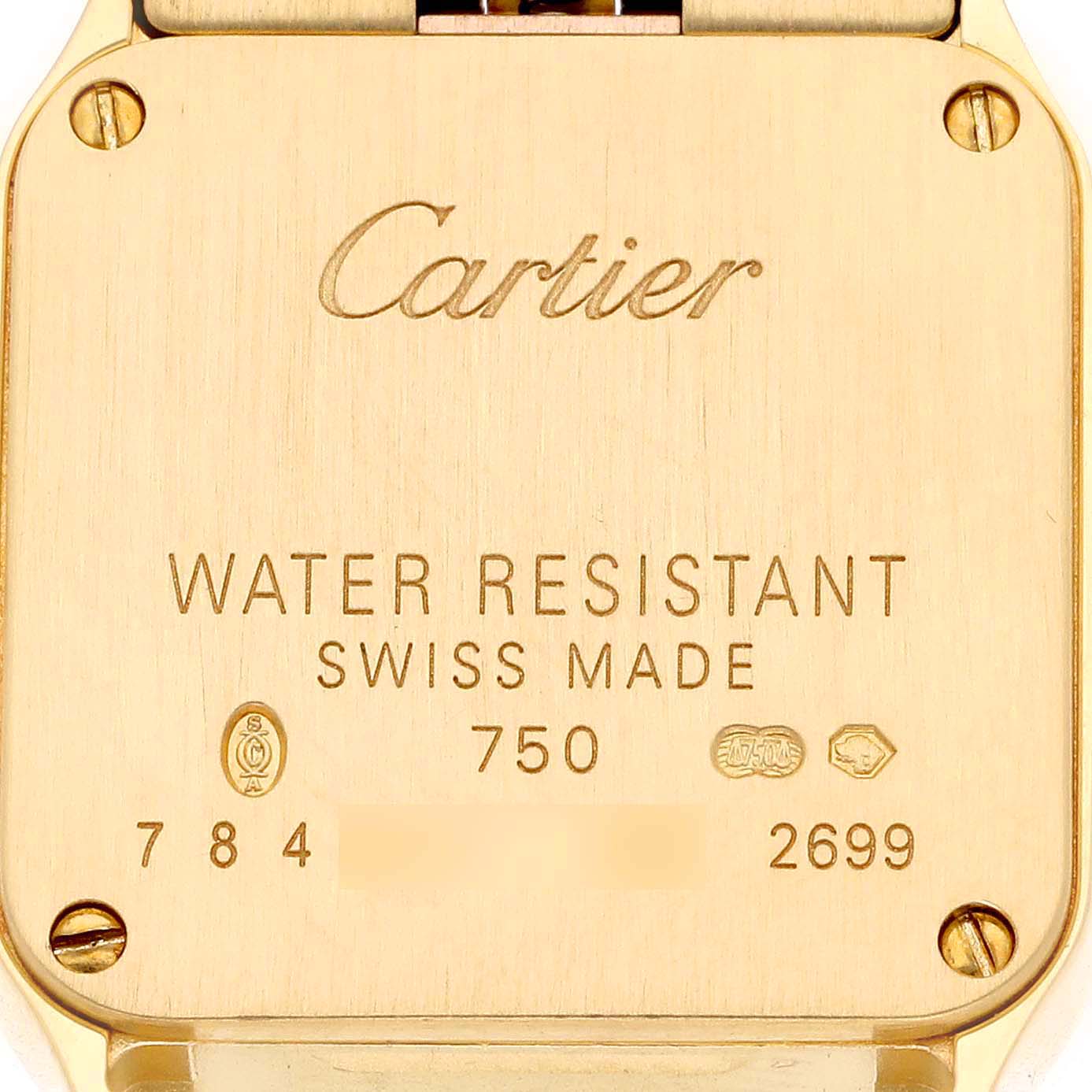 This image shows the back of the Cartier Santos Demoiselle W25063X9 Women's Yellow Gold Silver Dial W25063X9 Women's Yellow Gold Silver Dial watch, highlighting the engravings and screws.