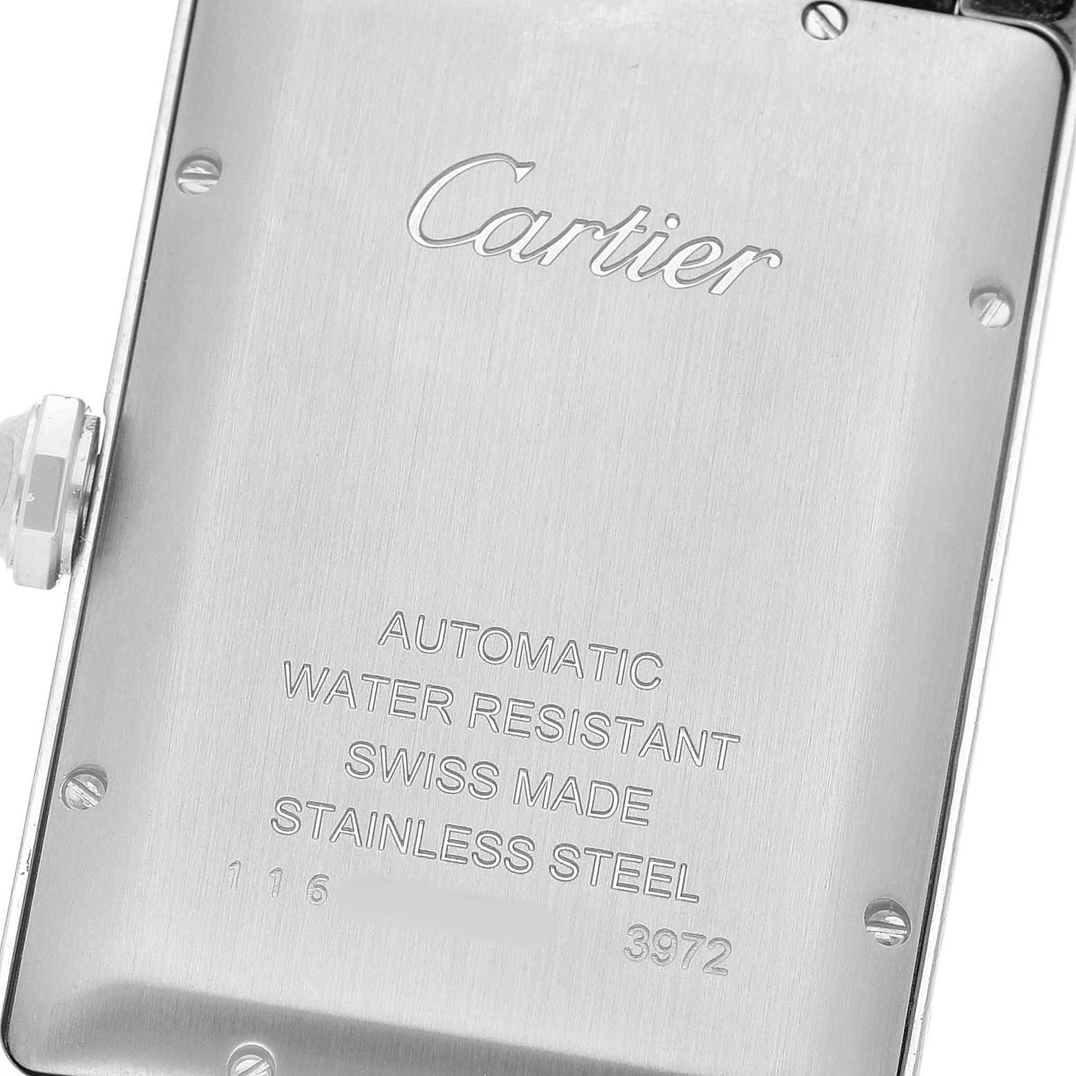The image shows the back case of a Cartier Tank Americaine WSTA0018 Men's Stainless Steel Silver Dial watch, highlighting the brand, model details, and material.