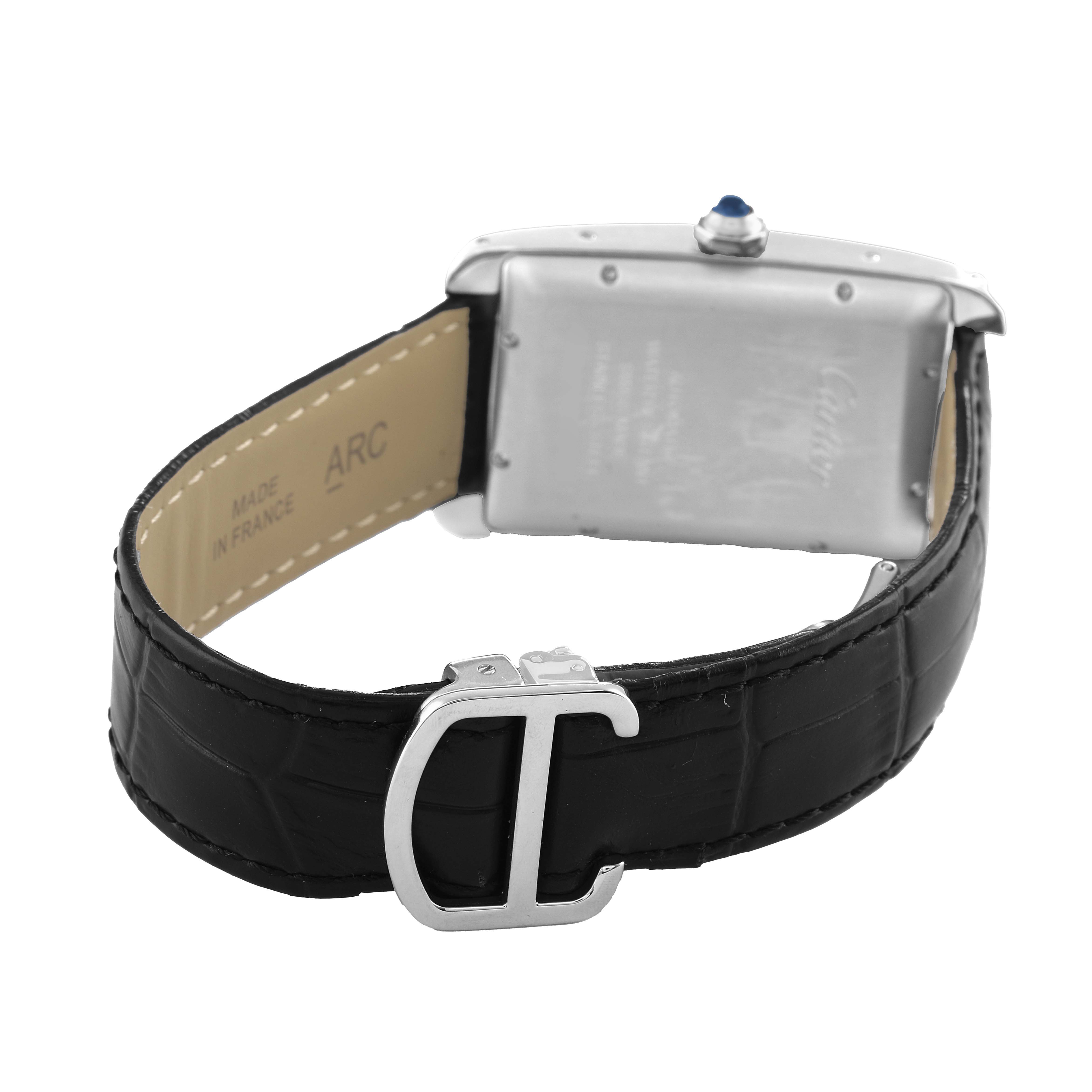 The image shows the back of a Cartier Tank Américaine watch, highlighting the case, crown, and leather strap with buckle.