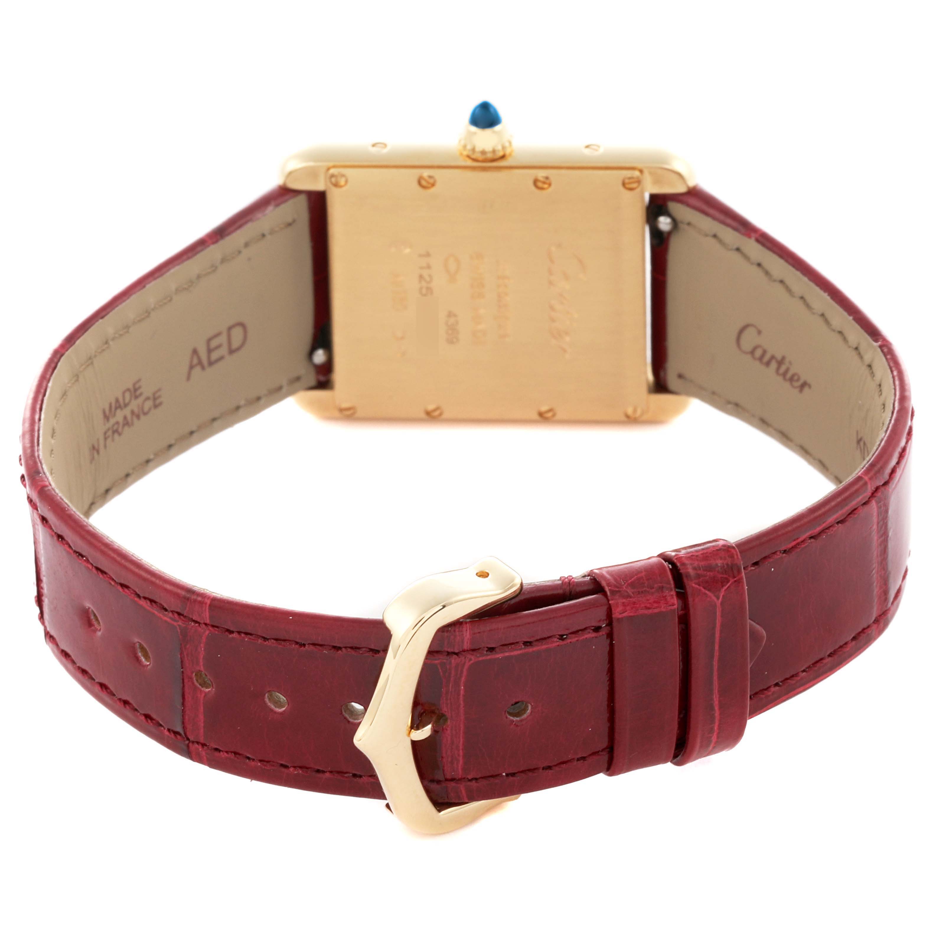 The image shows the back of a Cartier Tank Louis WGTA0190 Men's Yellow Gold Red Dial WGTA0190 Men's Yellow Gold Red Dial watch, highlighting the caseback, strap, and buckle.