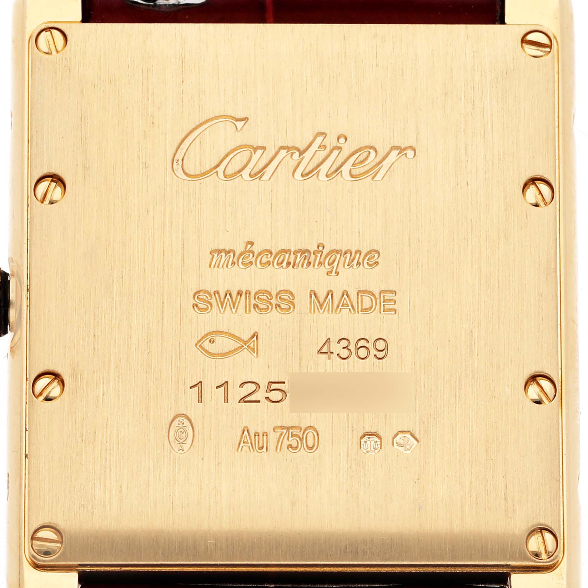 The image shows the back case of the Cartier Tank Louis WGTA0190 Men's Yellow Gold Red Dial WGTA0190 Men's Yellow Gold Red Dial watch, highlighting engraving details and screws.