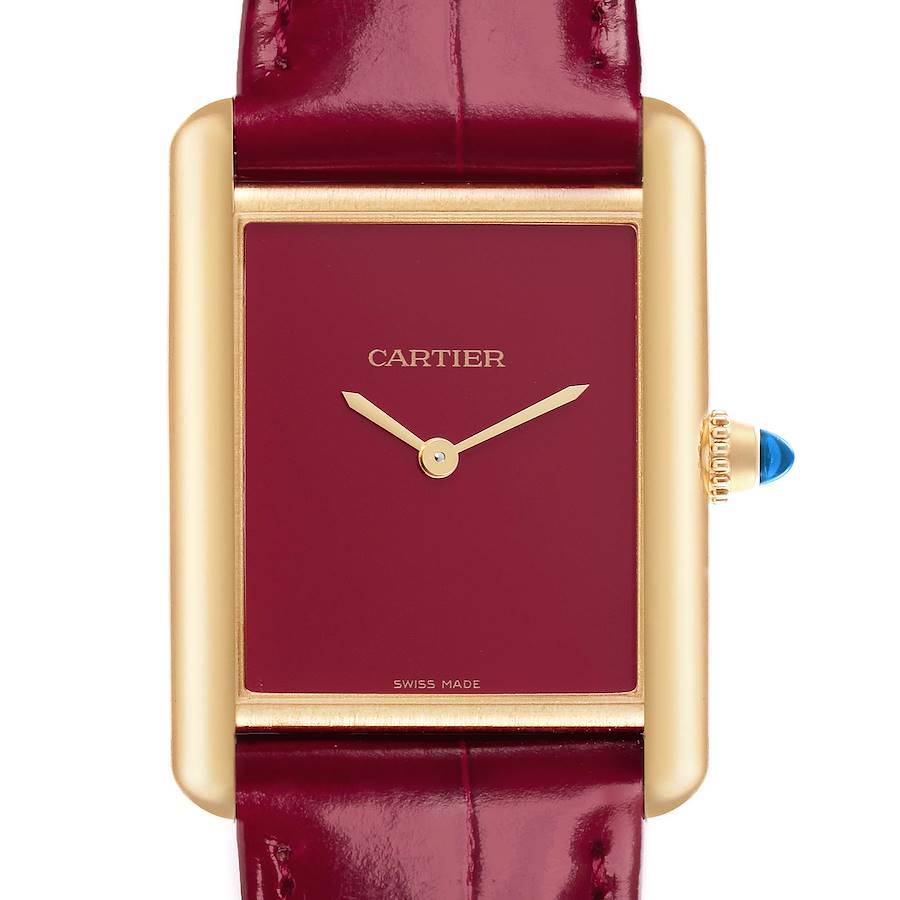 The Cartier Tank Louis watch is shown from the front, highlighting its red dial, gold case, and leather strap.