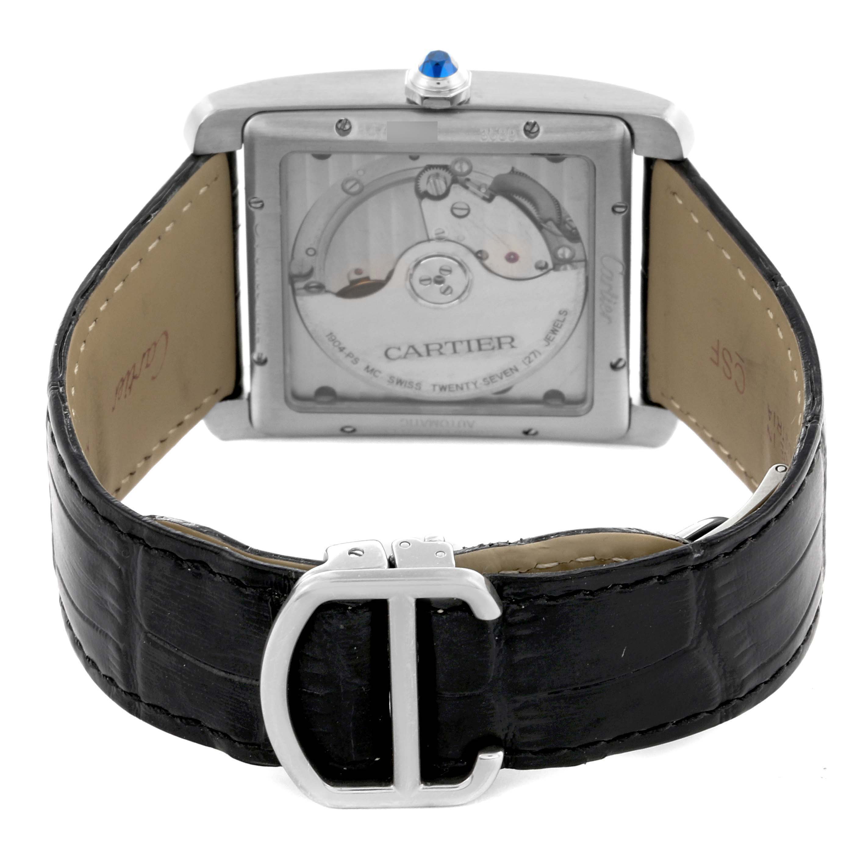 The image shows the back of the Cartier Tank MC W5330003 Men
s Stainless Steel Silver Dial W5330003 Men
s Stainless Steel Silver Dial watch, highlighting its transparent case back and black leather strap with a buckle.