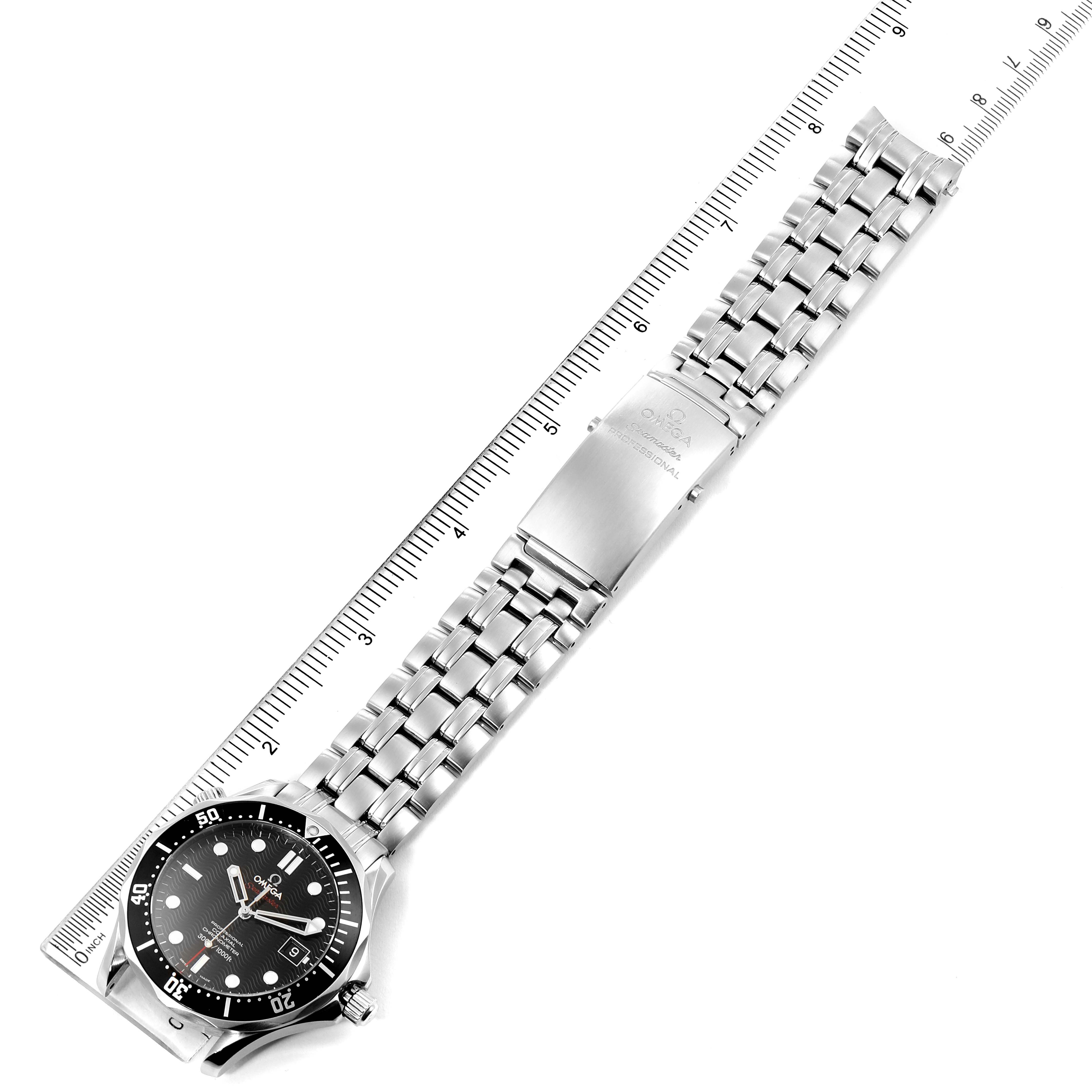 The image shows an Omega Seamaster 212.30.41.20.01.002 Men
s Stainless Steel Black Dial 212.30.41.20.01.002 Men
s Stainless Steel Black Dial watch laid flat with its stainless steel bracelet fully extended, next to a ruler for scale.