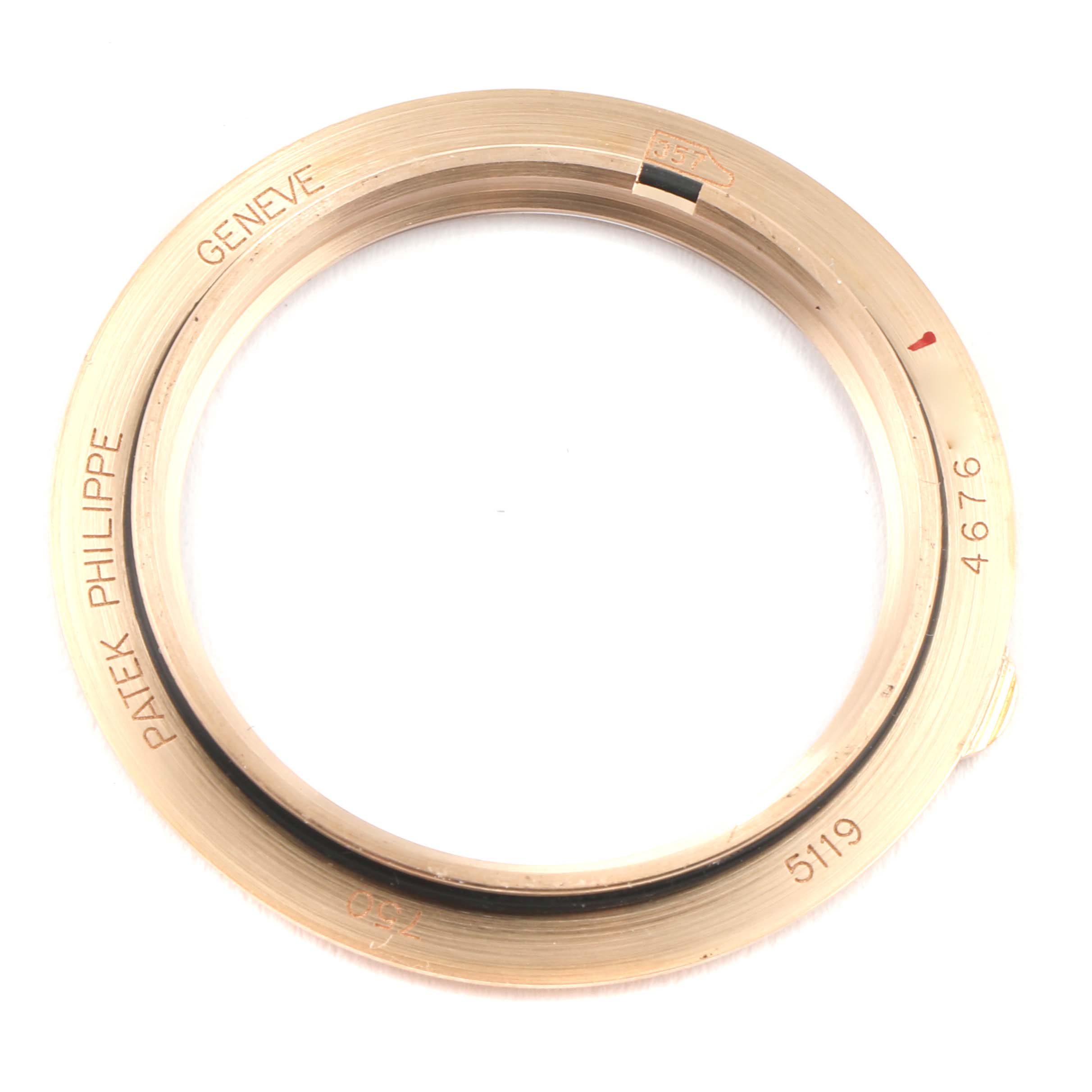 The image shows the bezel of a Patek Philippe Calatrava 5119R Men
s Rose Gold White Dial 5119R Men
s Rose Gold White Dial model watch from a top-down angle.