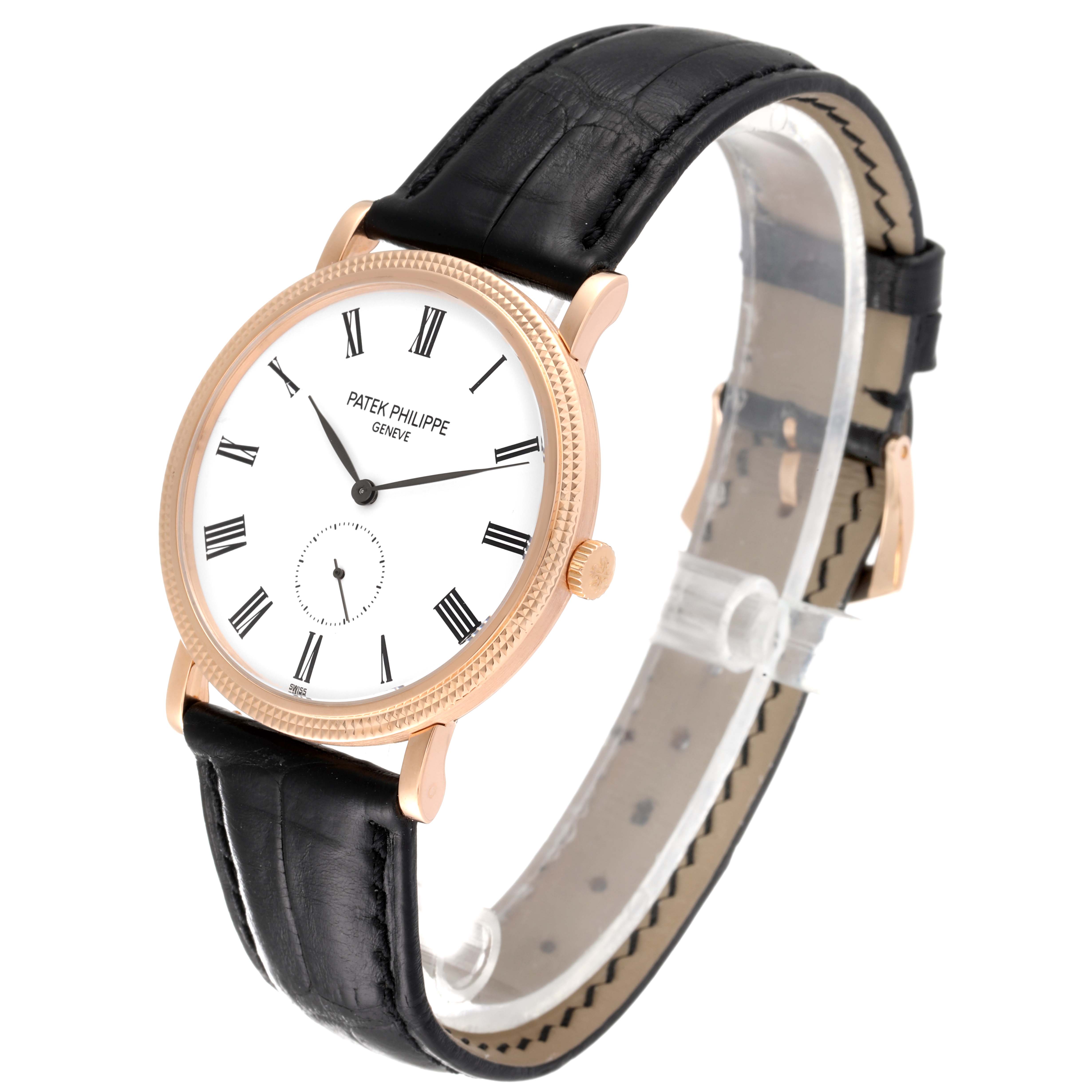 The Patek Philippe Calatrava 5119R Men
s Rose Gold White Dial 5119R Men
s Rose Gold White Dial watch is shown at a three-quarter angle, highlighting its black leather strap, white dial, and Roman numeral markers.