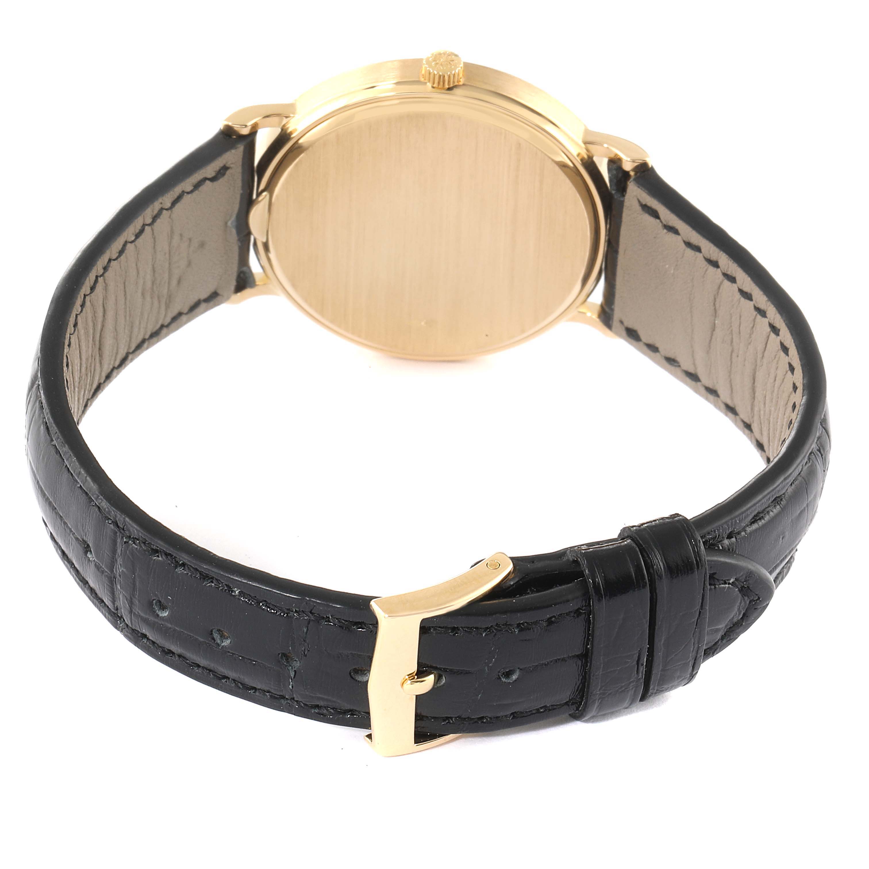 This image shows the back and strap of the Patek Philippe Calatrava 3954J Men's Yellow Gold White Dial 3954J Men's Yellow Gold White Dial watch from a rear angle.