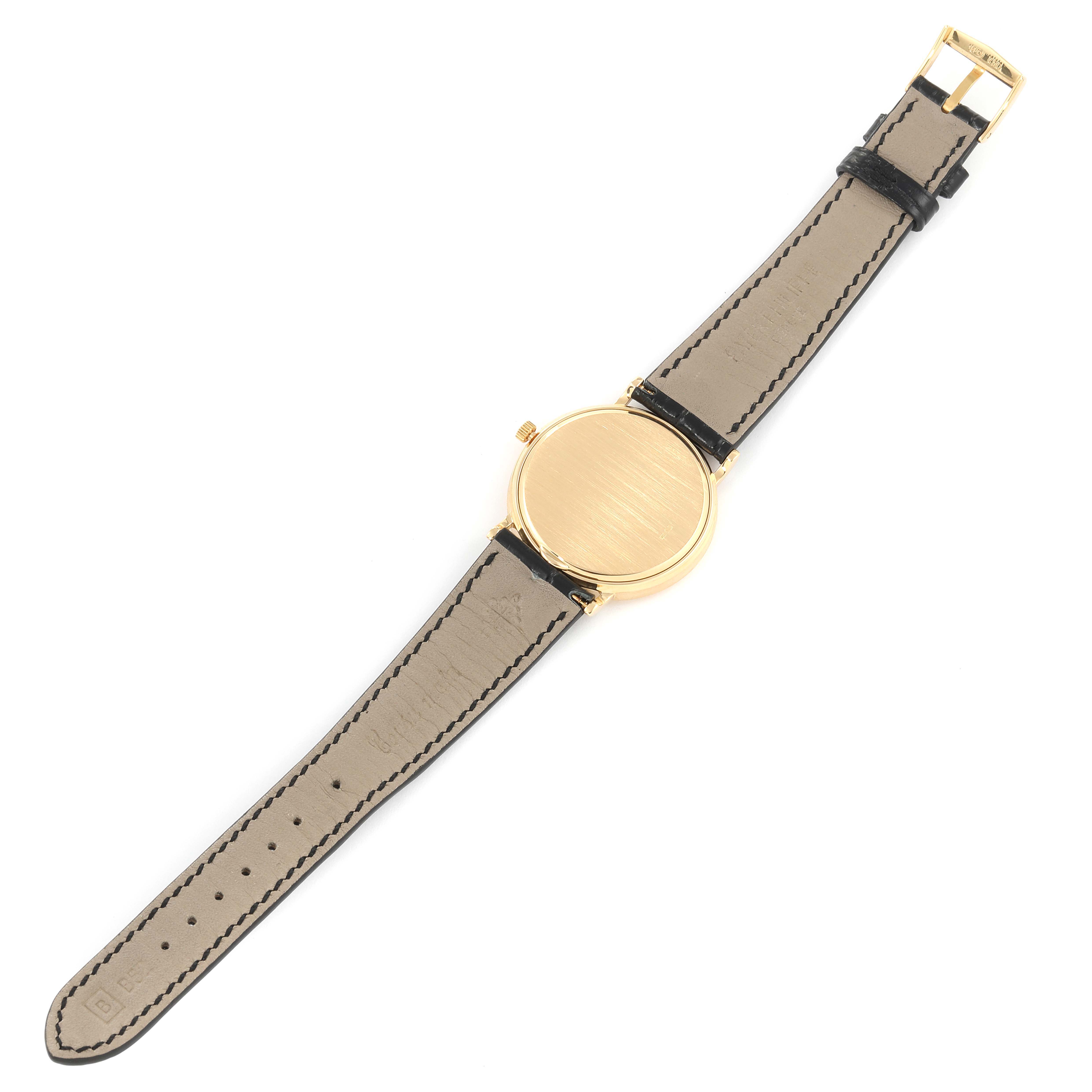 This image shows the back view of a Patek Philippe Calatrava 3954J Men's Yellow Gold White Dial 3954J Men's Yellow Gold White Dial watch including the strap and buckle.