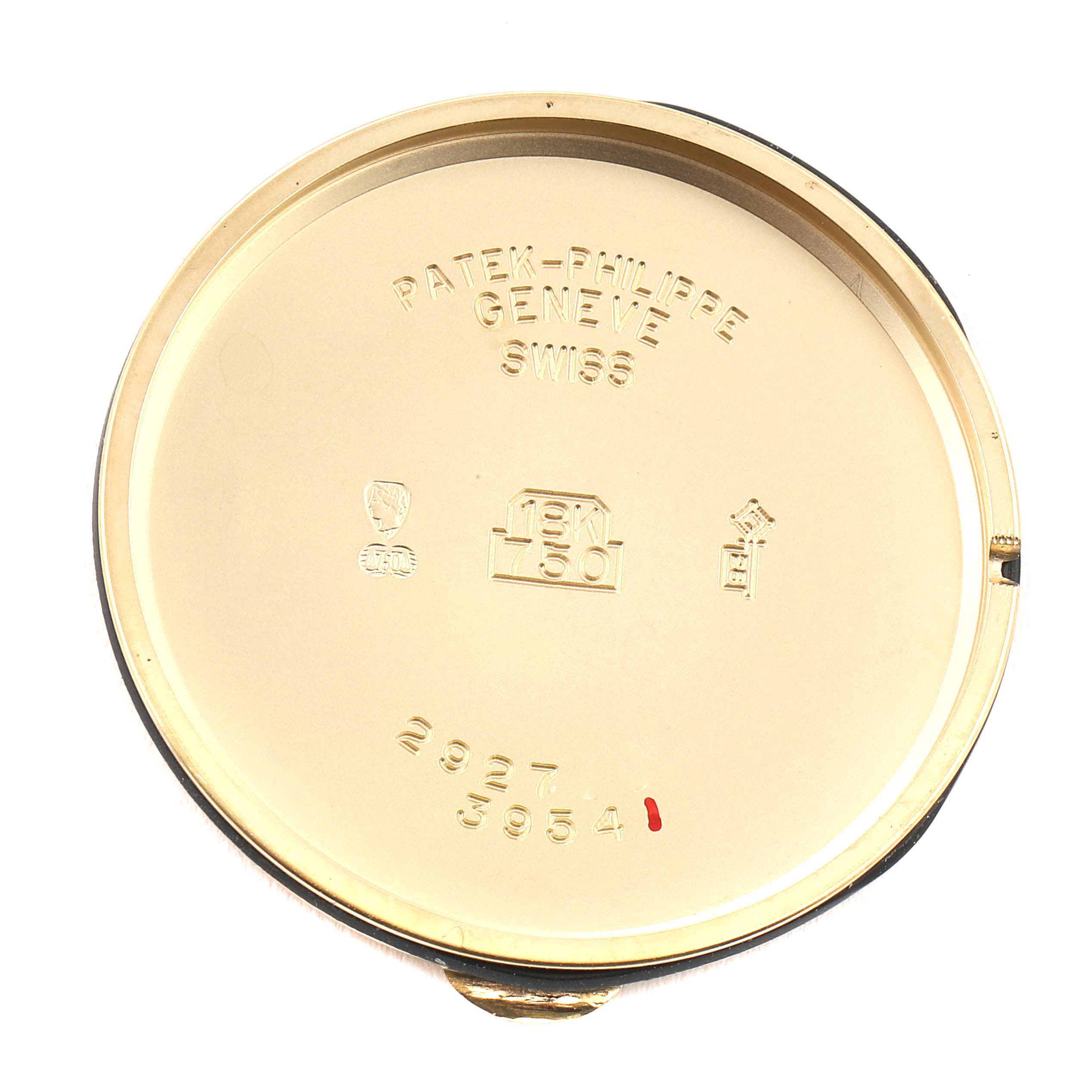 This is the inside case back of a Calatrava model watch by Patek Philippe, showing engravings and hallmarks.