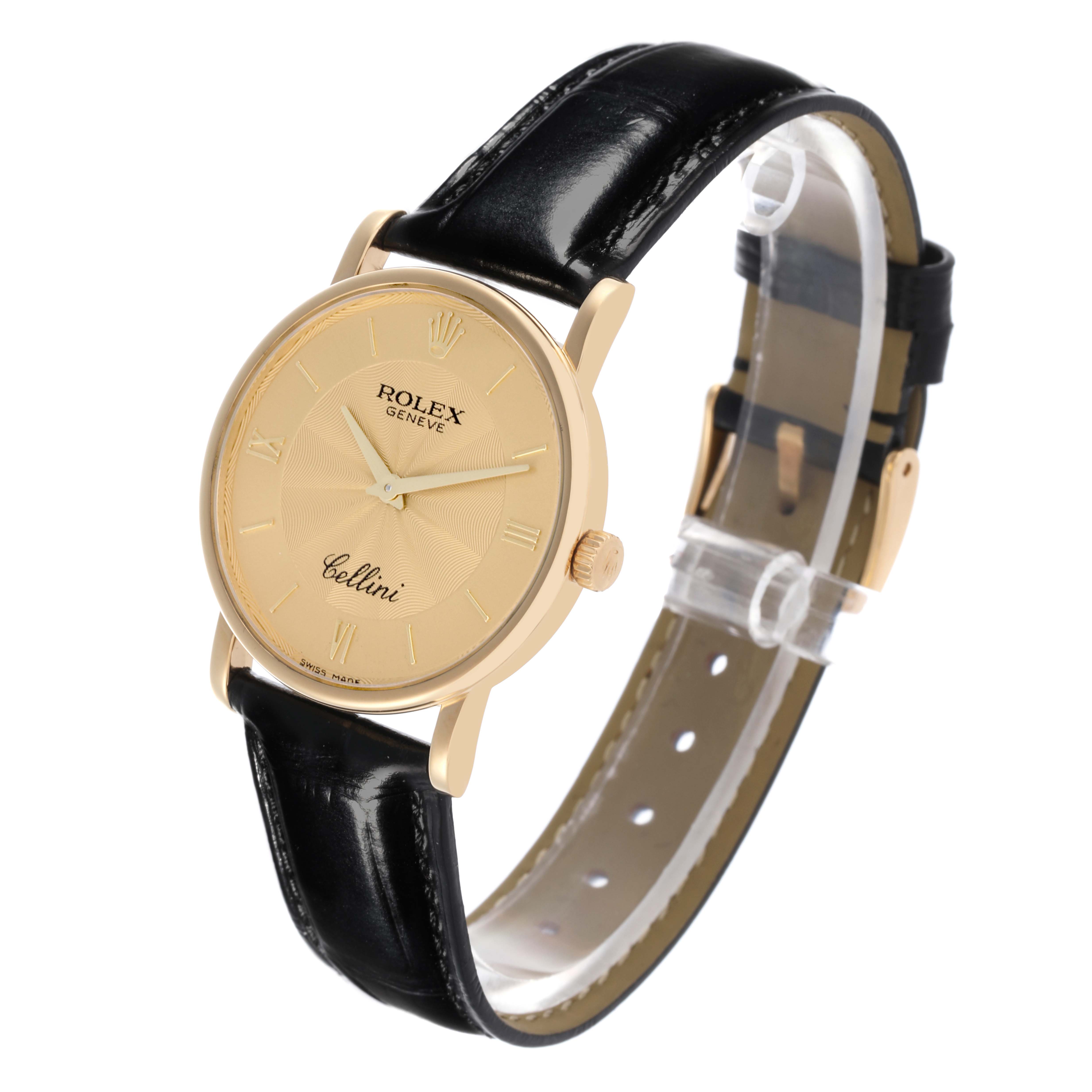 The Rolex Cellini 5115 Men's Yellow Gold Champagne Dial 5115 Men's Yellow Gold Champagne Dial watch is shown at a three-quarter angle, highlighting its gold case, dial, and black leather strap.