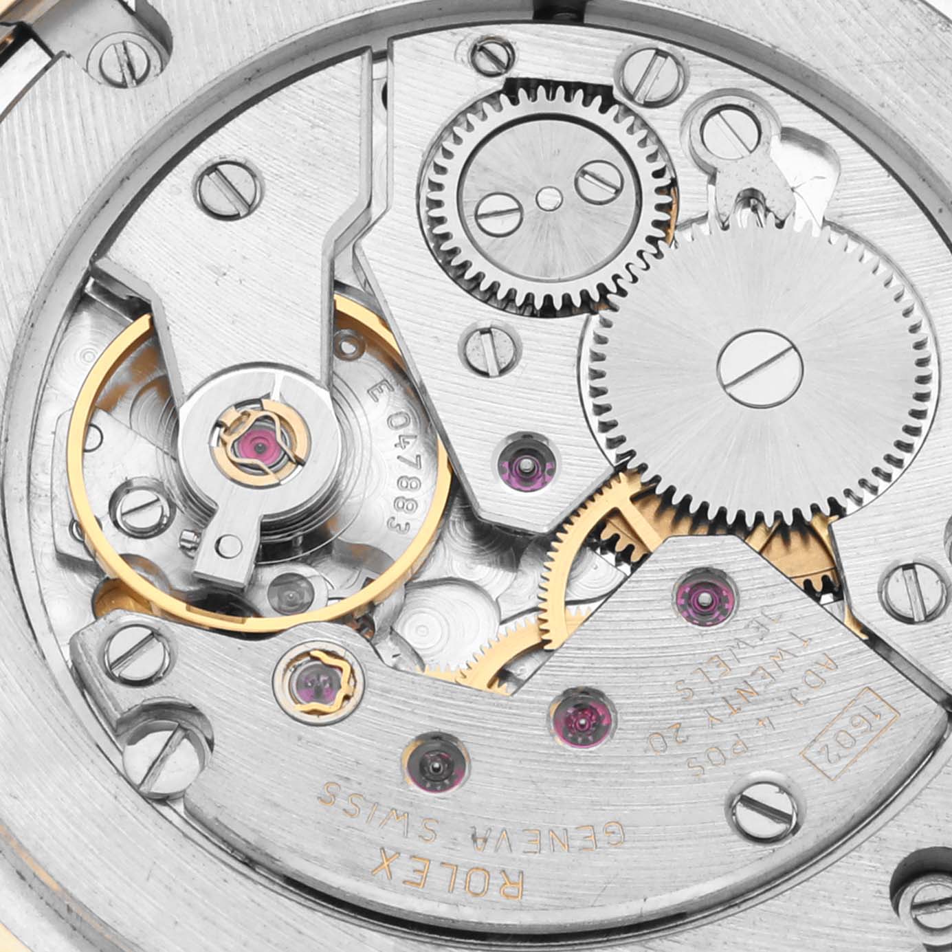 The image shows a close-up of the movement mechanism inside a Rolex Cellini 5115 Men's Yellow Gold Champagne Dial 5115 Men's Yellow Gold Champagne Dial watch, highlighting gears and screws.