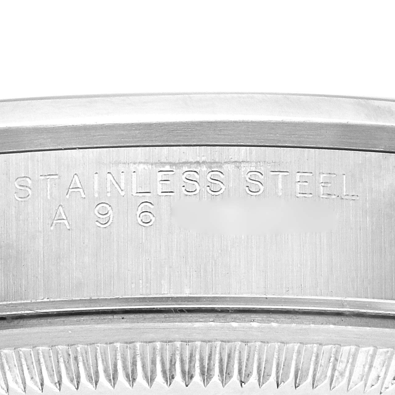 The image shows an angled close-up of the Rolex Date 15200 Men's Stainless Steel Black Dial 15200 Men's Stainless Steel Black Dial's stainless steel case with engraved text.