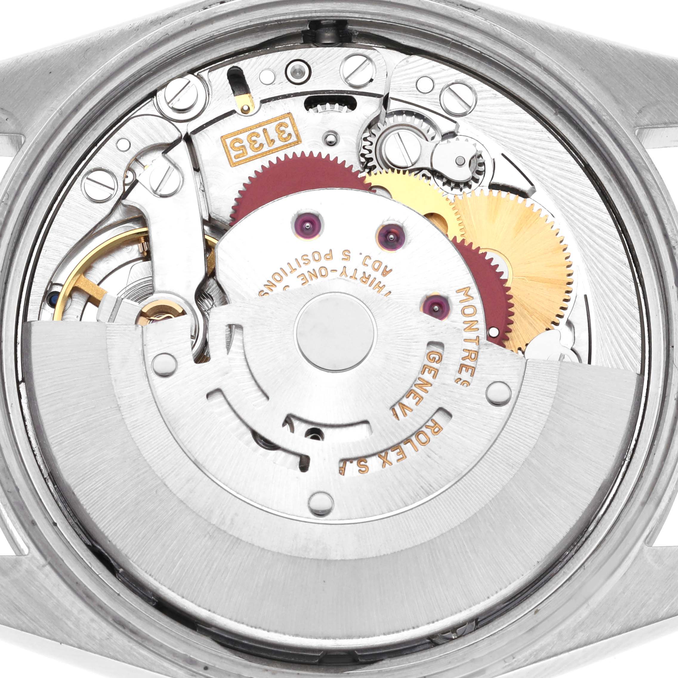 The image shows the movement of a Rolex Date 15200 Men's Stainless Steel Black Dial 15200 Men's Stainless Steel Black Dial model from a top angle, highlighting gears and internal mechanisms.