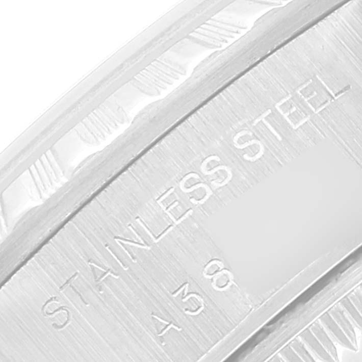 This close-up image shows the stainless steel case engraving on a Rolex Date 79240 Women
s Stainless Steel Silver Dial 79240 Women
s Stainless Steel Silver Dial model watch.