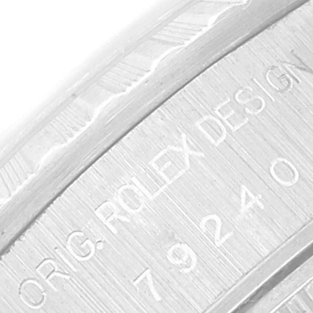 This image shows a close-up of the engraved case back of a Rolex Date 79240 Women
s Stainless Steel Silver Dial 79240 Women
s Stainless Steel Silver Dial model watch.