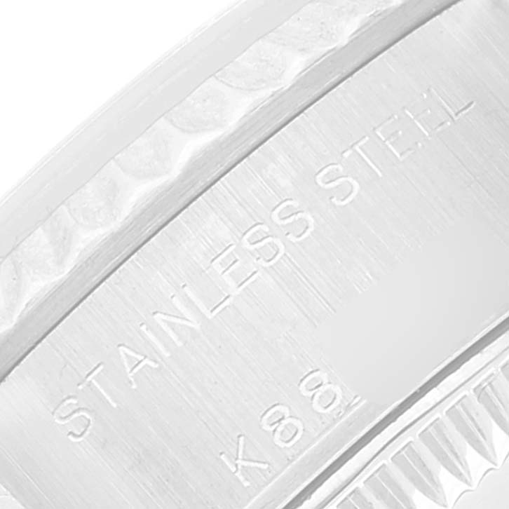 This close-up image shows the "STAINLESS STEEL" engraving on the case back of a Rolex Datejust 79174 Women's Stainless Steel Silver Dial 79174 Women's Stainless Steel Silver Dial watch.