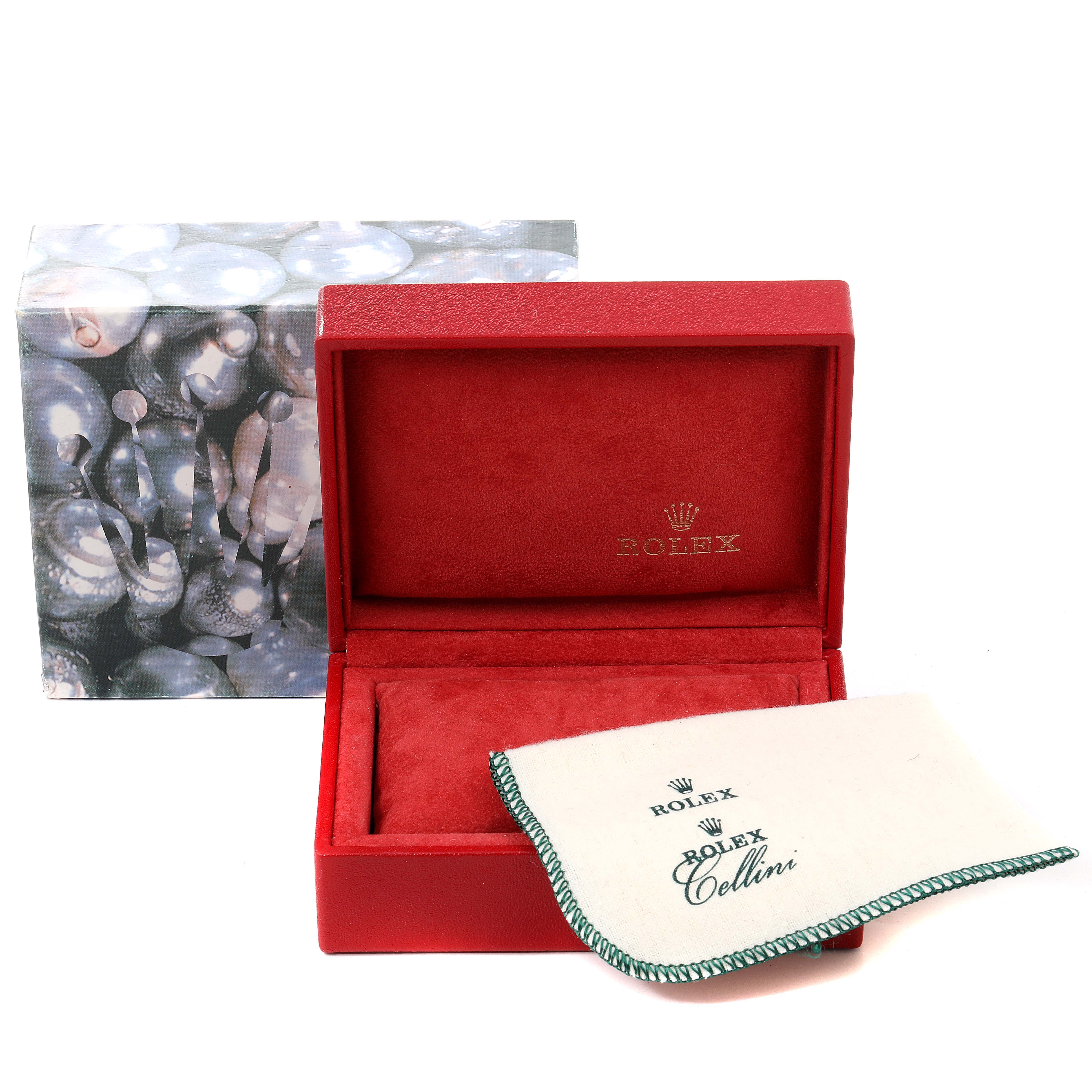 The image shows a red Rolex Datejust 79173 Women's Steel and Gold (two tone) Champagne Dial 79173 Women's Steel and Gold (two tone) Champagne Dial watch box, partially open, with a branded protective cloth and the outer packaging.