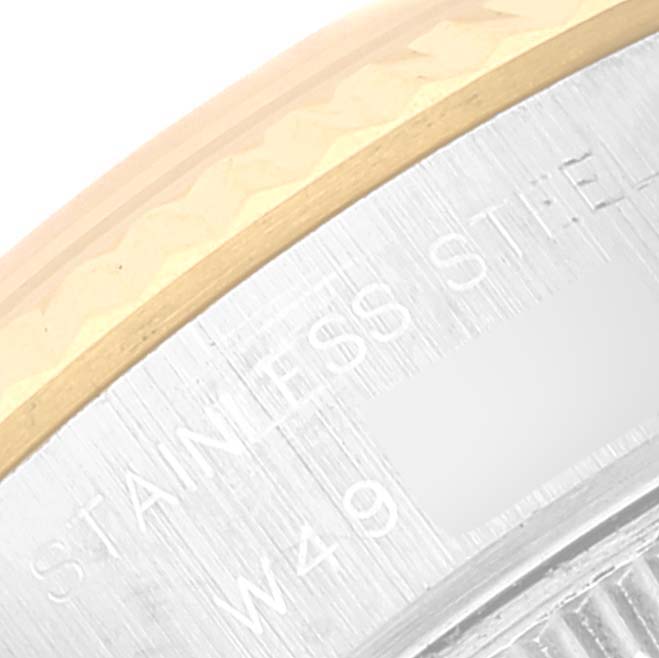 The image shows a close-up of the rim and part of the back case of a Rolex Datejust 69173 Women's Steel and Gold (two tone) White Dial 69173 Women's Steel and Gold (two tone) White Dial watch.