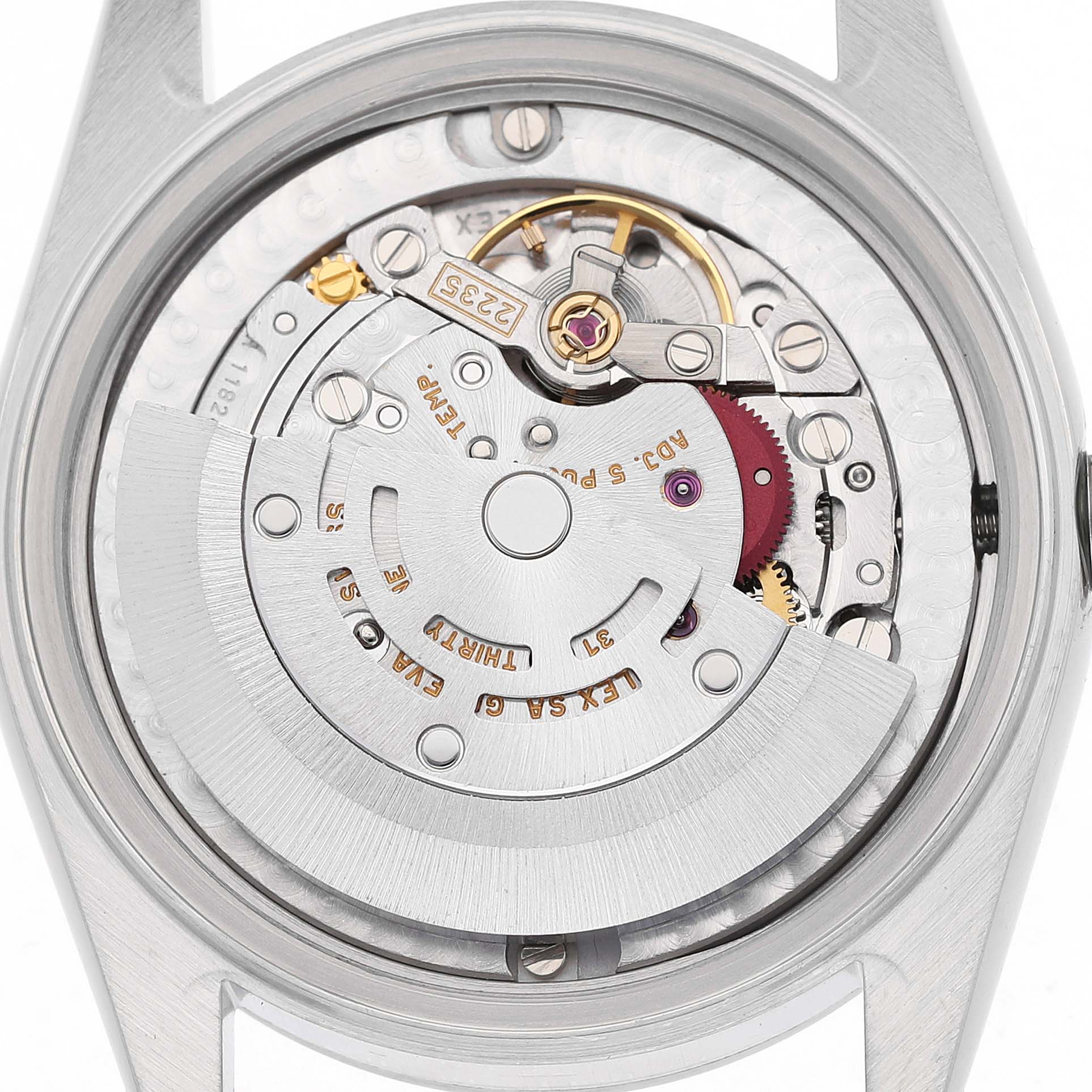 The image shows the movement of a mid-size Rolex watch from a back view, highlighting the rotor and intricate components.