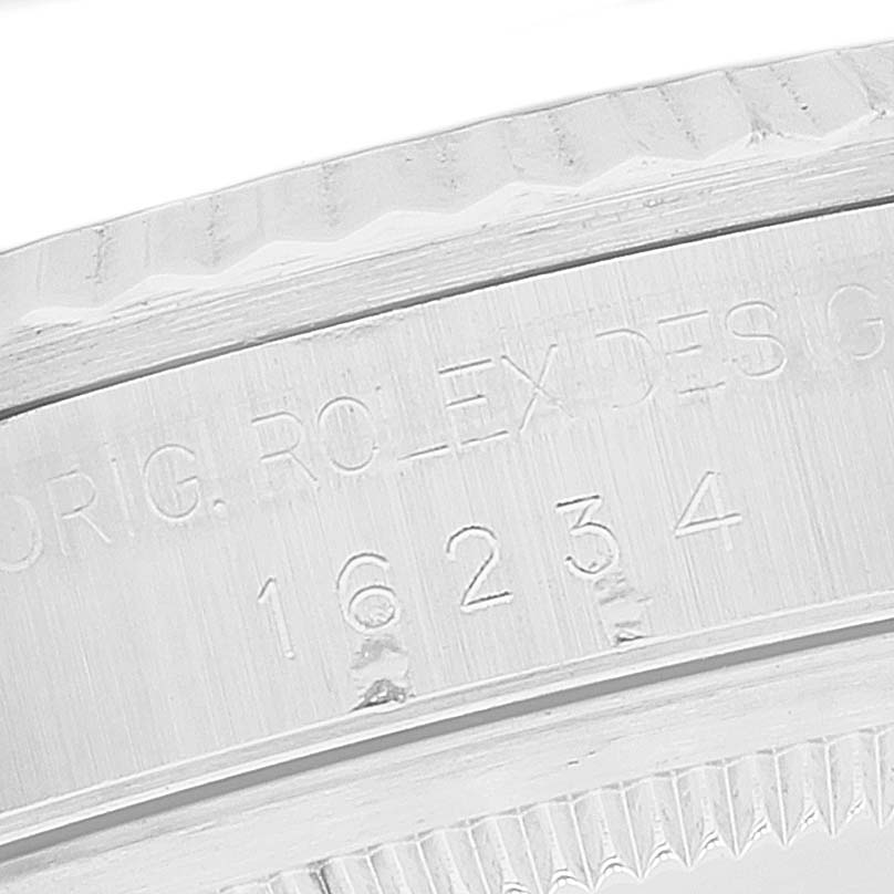The image shows a close-up angle of the watch case of a Rolex Datejust 16234 Men's Stainless Steel Silver Dial 16234 Men's Stainless Steel Silver Dial, highlighting the engraved model number and branding.