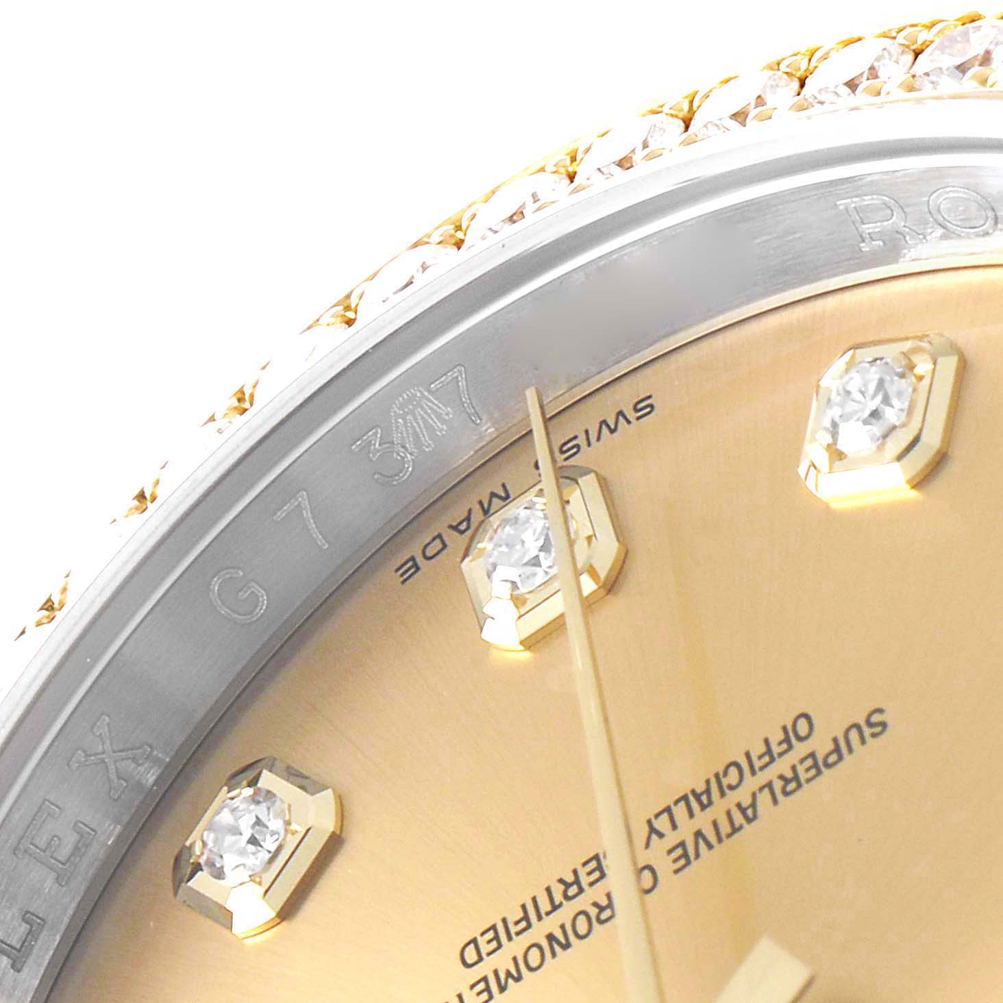 The image shows a close-up of the dial, bezel, and part of the Rolex Datejust 116243 Men
s Steel and Gold (two tone) Champagne Dial 116243 Men
s Steel and Gold (two tone) Champagne Dial watch face with diamond hour markers.