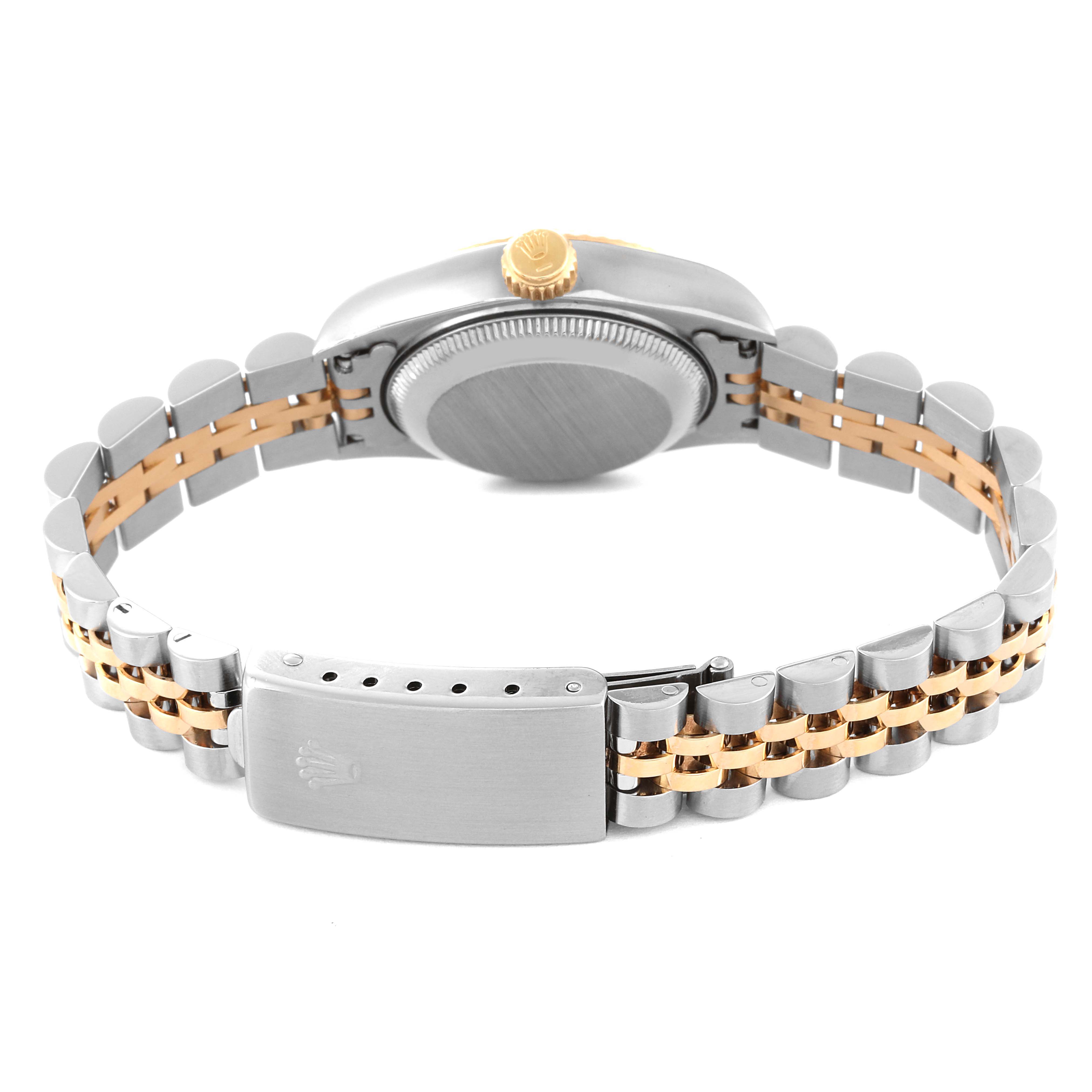 The image shows the back view of a Rolex Datejust 69173 Women's Steel and Gold (two tone) Champagne Dial 69173 Women's Steel and Gold (two tone) Champagne Dial watch with its clasp and crown visible.