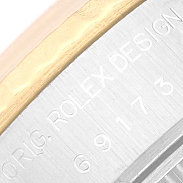 The image shows a close-up angle of the bezel and part of the casing of a Rolex Datejust 69173 Women's Steel and Gold (two tone) Champagne Dial 69173 Women's Steel and Gold (two tone) Champagne Dial model.
