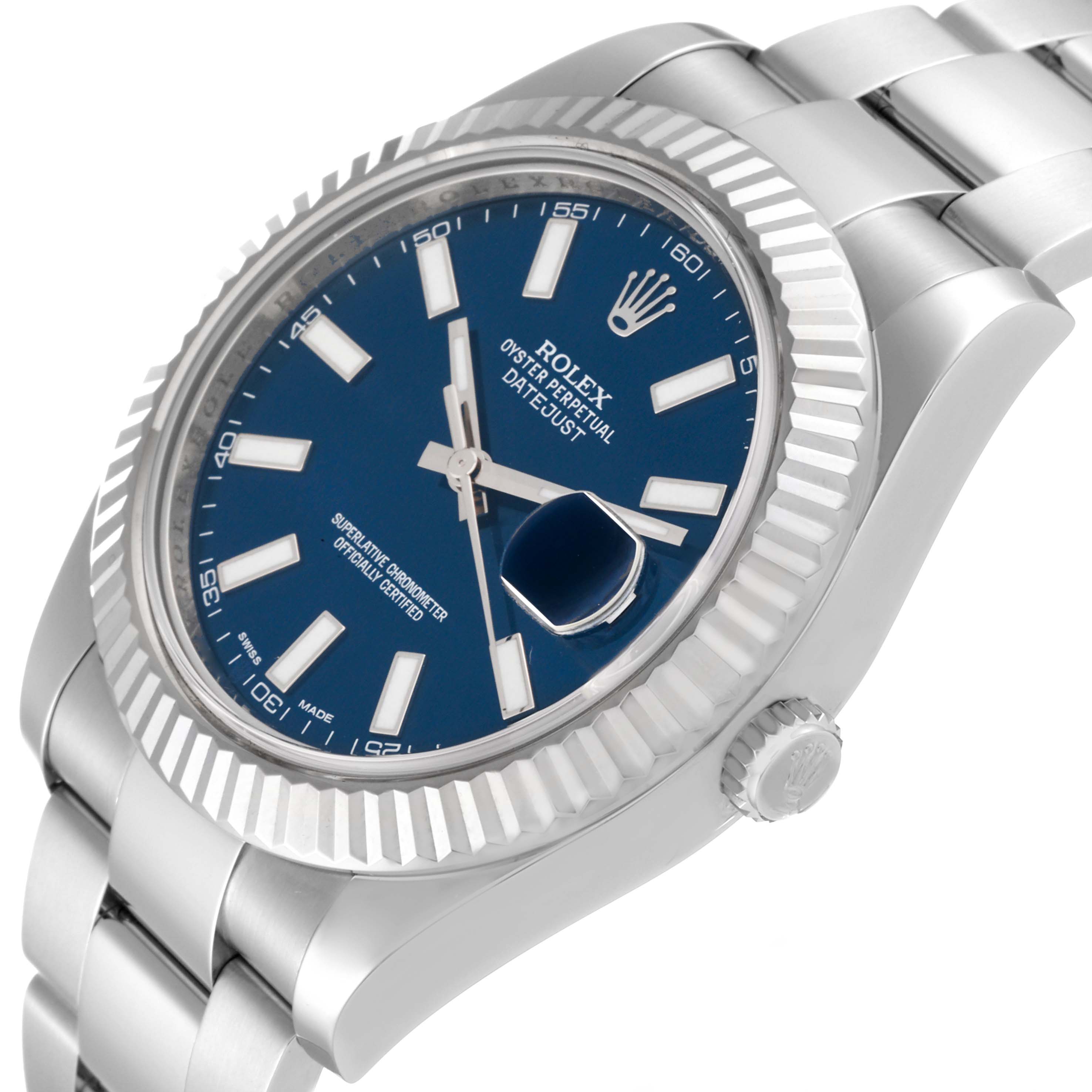 The Rolex Datejust 41 116334 Men
s Stainless Steel Blue Dial 116334 Men
s Stainless Steel Blue Dial watch is shown at a slight angle, highlighting its fluted bezel, blue dial, and Oyster bracelet.