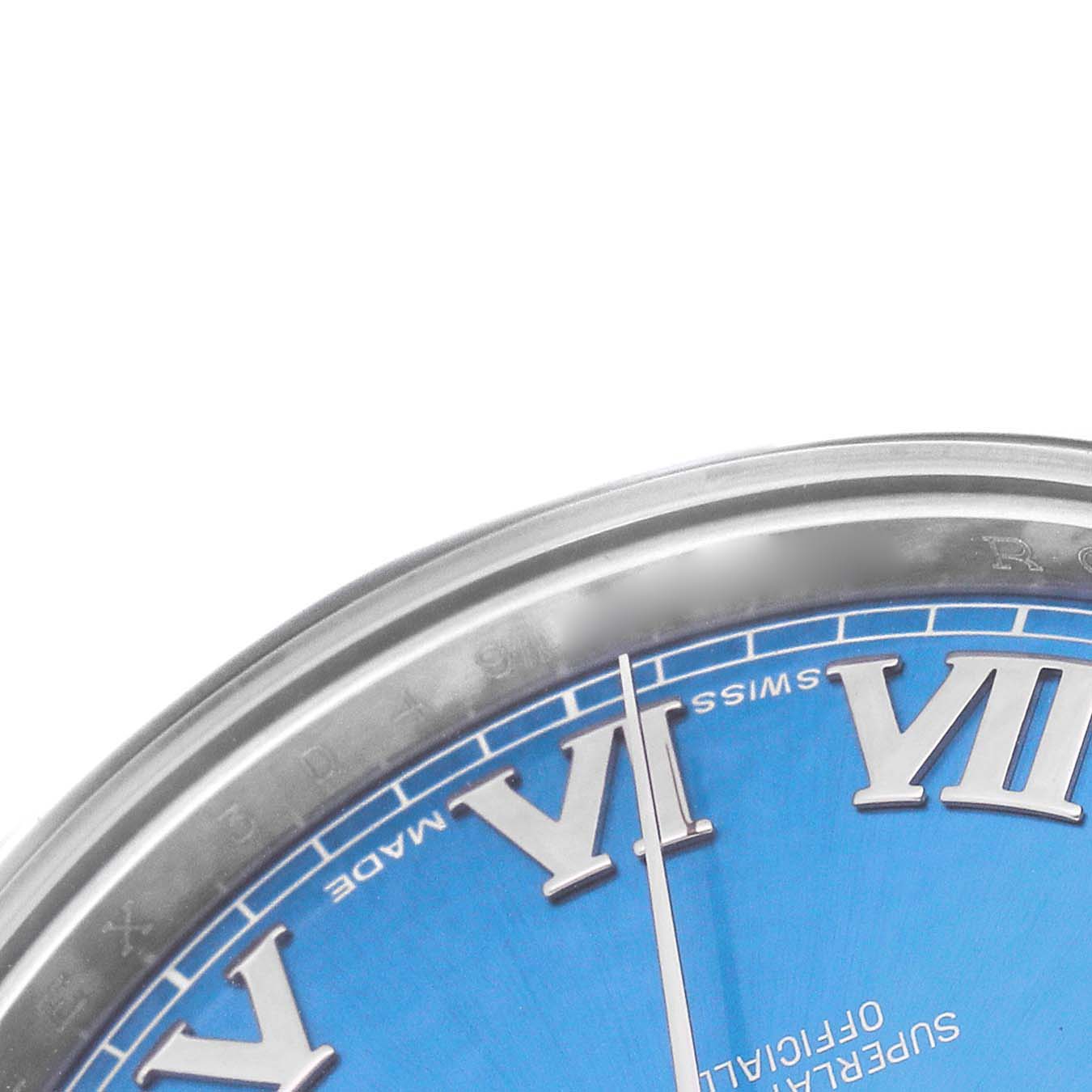 The image shows a close-up of the dial and bezel of a Rolex Datejust 41 116300 Men's Stainless Steel Blue Dial, highlighting the Roman numerals and blue face.