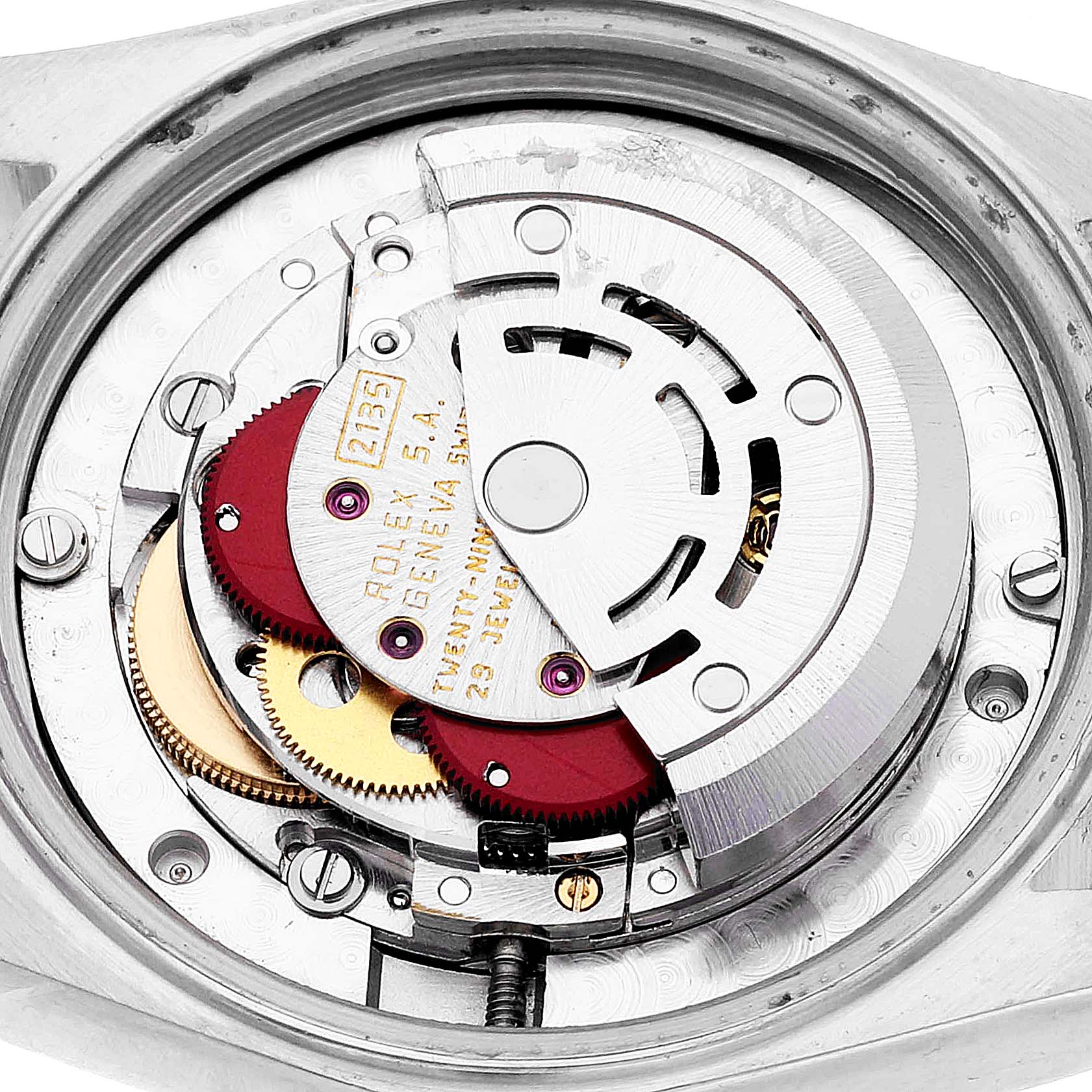 The image shows a close-up of the internal mechanism of a Mid-Size Rolex watch, highlighting its intricate gears and components.