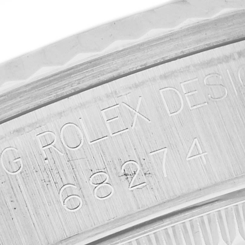 The image shows a close-up of the engraved model number on the caseback of a Rolex Mid-Size 68274 Women's Stainless Steel Black Dial 68274 Women's Stainless Steel Black Dial watch.