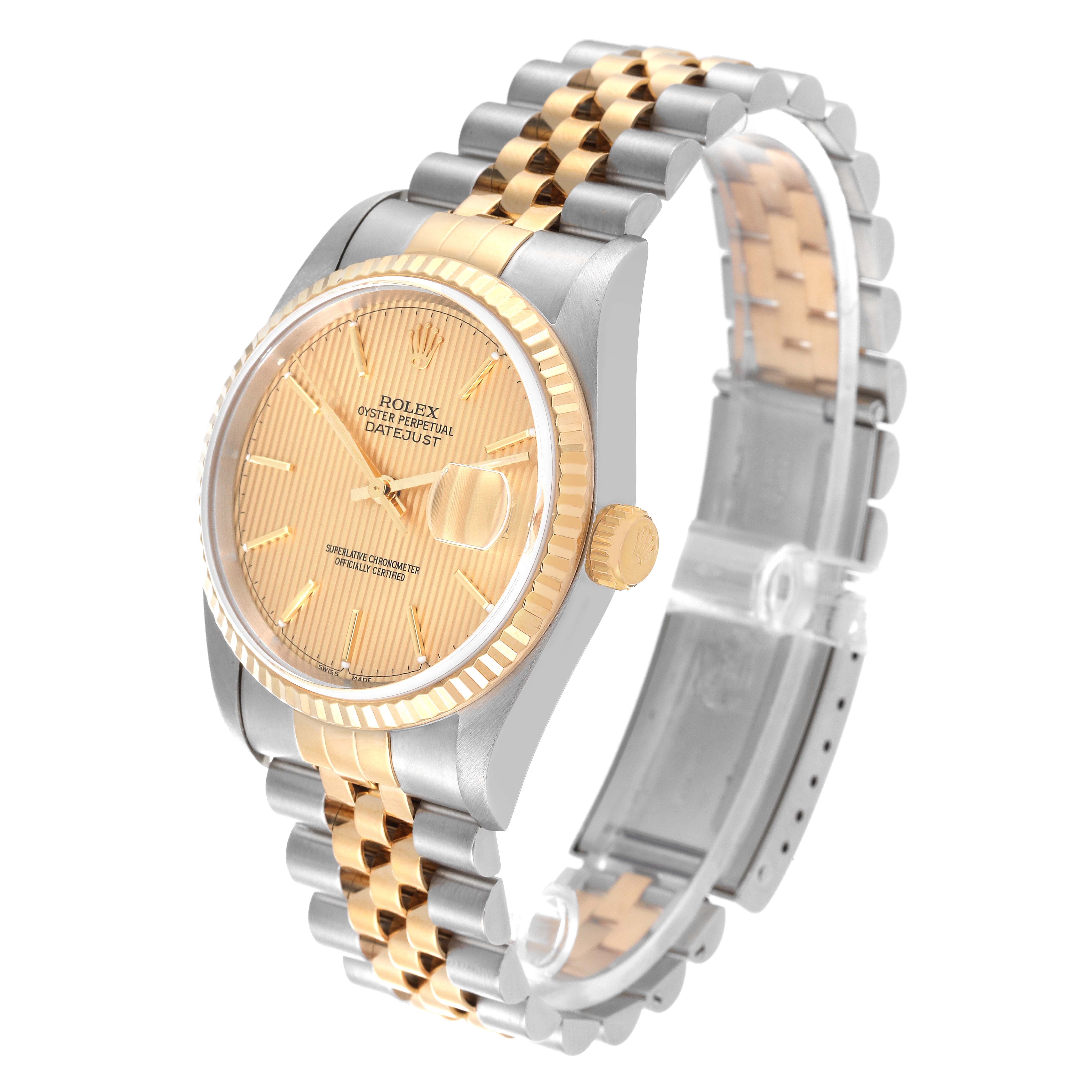 The Rolex Datejust 16233 Men's Steel and Gold (two tone) Champagne Dial 16233 Men's Steel and Gold (two tone) Champagne Dial watch is shown at a tilted angle, displaying the gold dial, fluted bezel, and two-tone bracelet.
