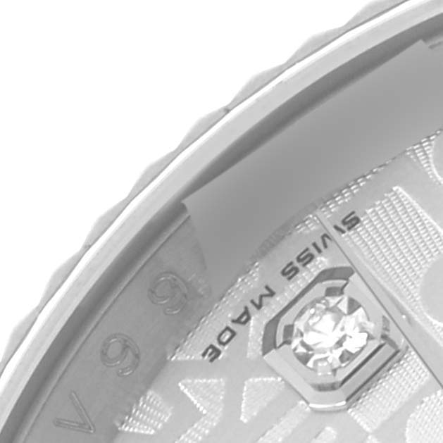 The close-up angle shows part of the dial and edge of the case of a Rolex Datejust 116234 Men
s Stainless Steel Silver Dial 116234 Men
s Stainless Steel Silver Dial, highlighting the "Swiss Made" text and a diamond marker.