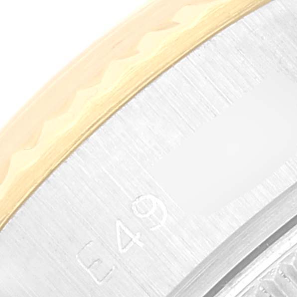 The image shows a close-up of the bezel and part of the case of a Rolex Datejust 69173 Women's Steel and Gold (two tone) Champagne Dial 69173 Women's Steel and Gold (two tone) Champagne Dial watch.