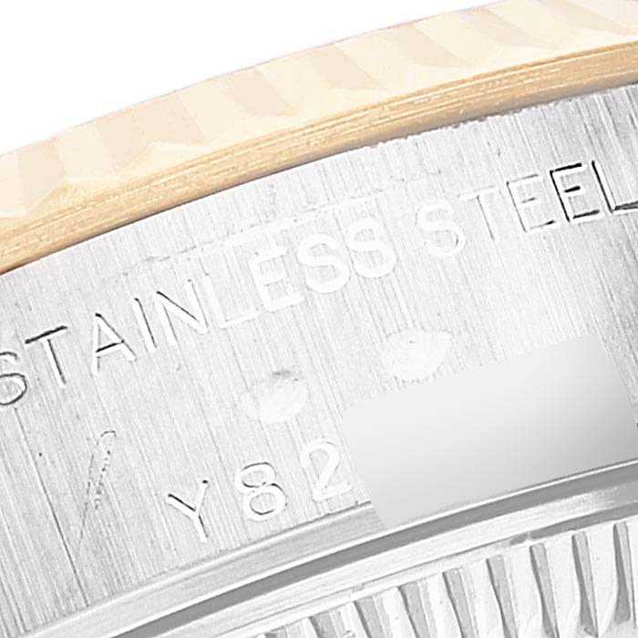 This image shows a close-up of the engraved bezel and case side of a Rolex Datejust 79173 Women's Steel and Gold (two tone) Champagne Dial 79173 Women's Steel and Gold (two tone) Champagne Dial watch, highlighting the "Stainless Steel" marking.