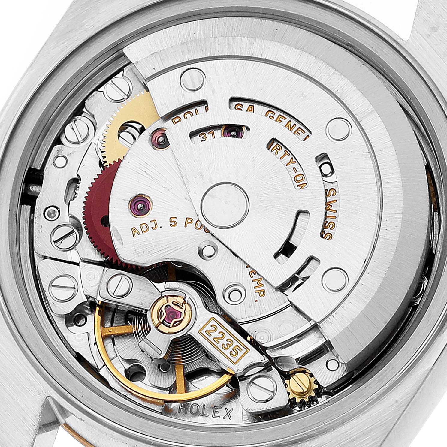 This is a close-up view of the Rolex Datejust 79173 Women's Steel and Gold (two tone) Champagne Dial 79173 Women's Steel and Gold (two tone) Champagne Dial watch's intricate movement mechanism, showcasing its gears and internal components.