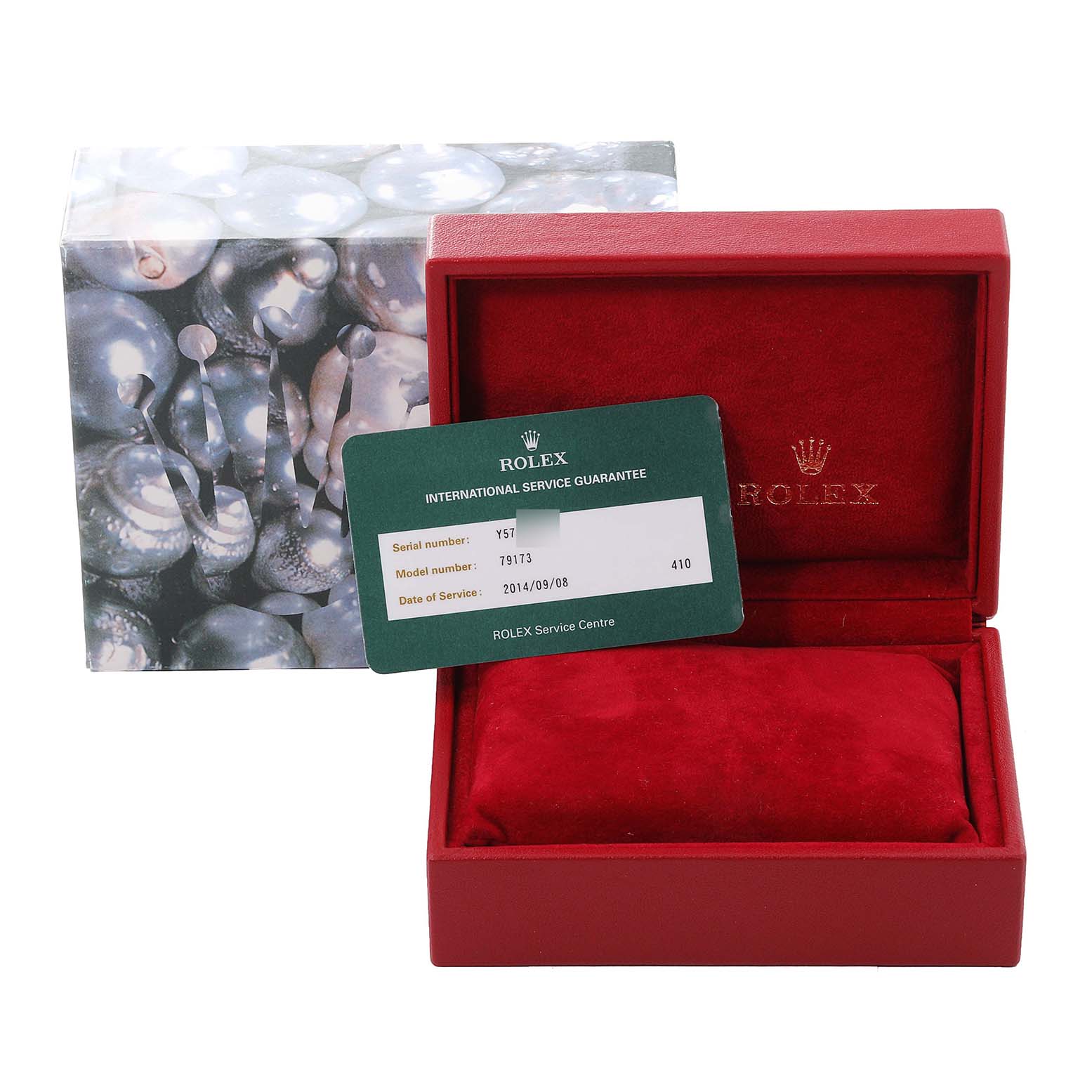 This image shows the packaging, service guarantee card, and box for a Rolex Datejust 79173 Women's Steel and Gold (two tone) Champagne Dial 79173 Women's Steel and Gold (two tone) Champagne Dial model.