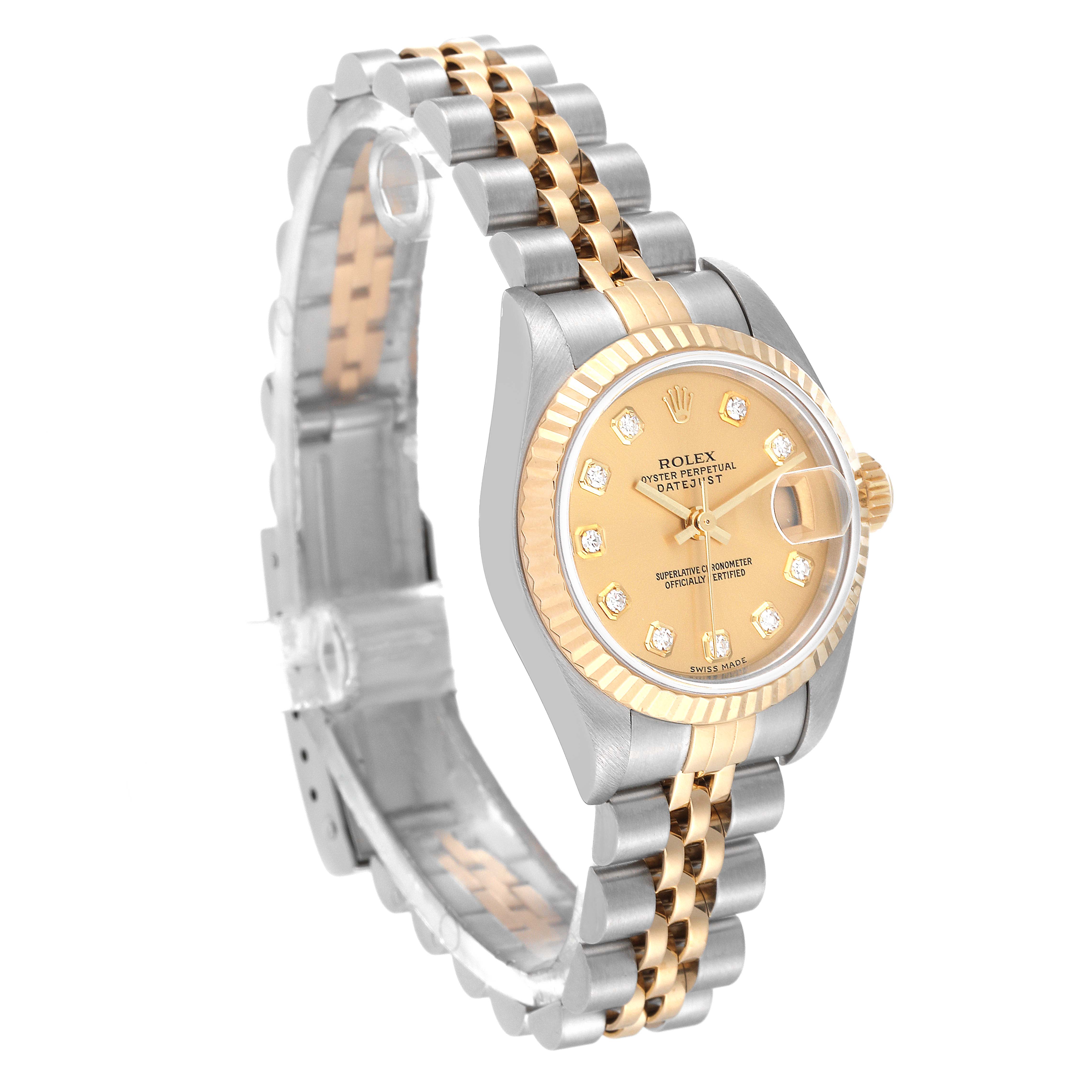 The Rolex Datejust 79173 Women's Steel and Gold (two tone) Champagne Dial 79173 Women's Steel and Gold (two tone) Champagne Dial watch is shown at an angled side view, highlighting its two-tone metal bracelet and diamond-encrusted gold dial.