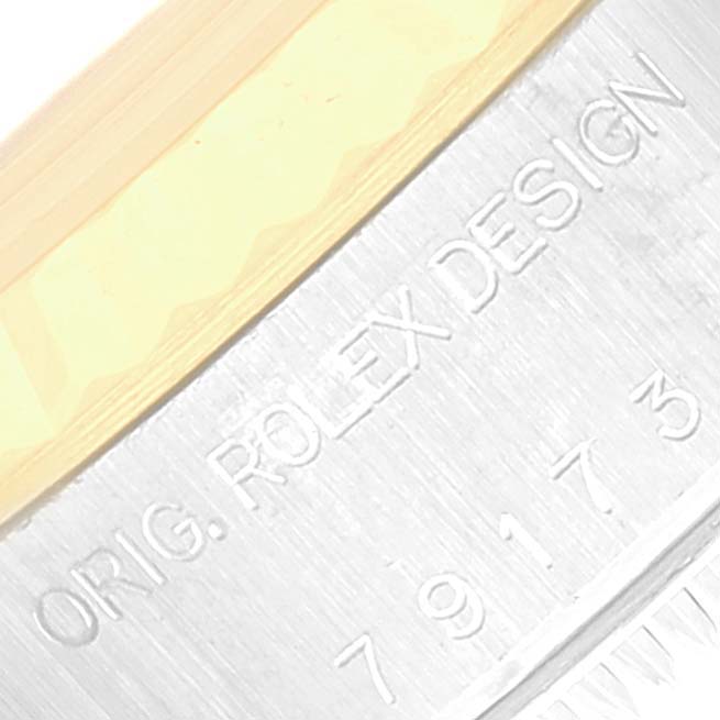This image shows a close-up of the engraved side of the Rolex Datejust 79173 Women's Steel and Gold (two tone) Champagne Dial 79173 Women's Steel and Gold (two tone) Champagne Dial, displaying the design number.