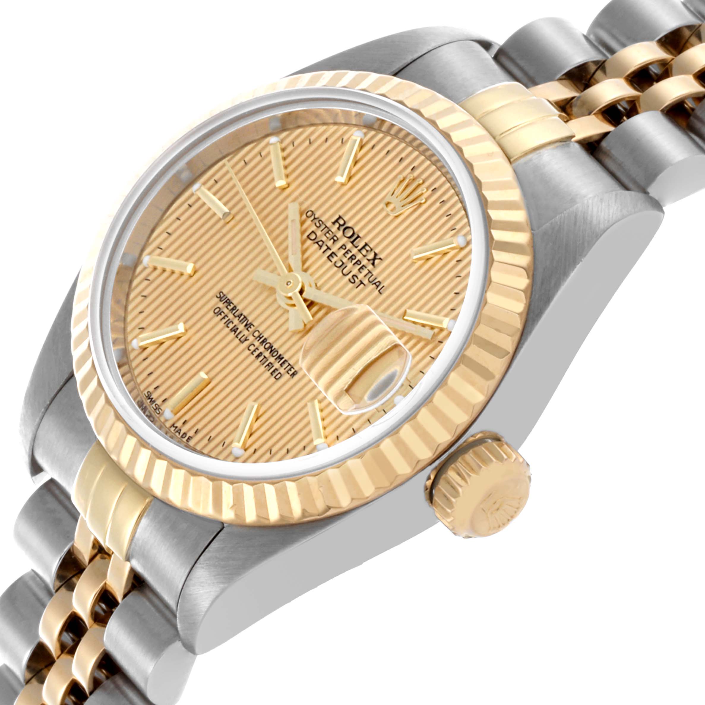 The image shows a Rolex Datejust 79173 Women's Steel and Gold (two tone) Champagne Dial 79173 Women's Steel and Gold (two tone) Champagne Dial watch at an angled side view, highlighting the gold dial, bezel, crown, and two-tone bracelet.