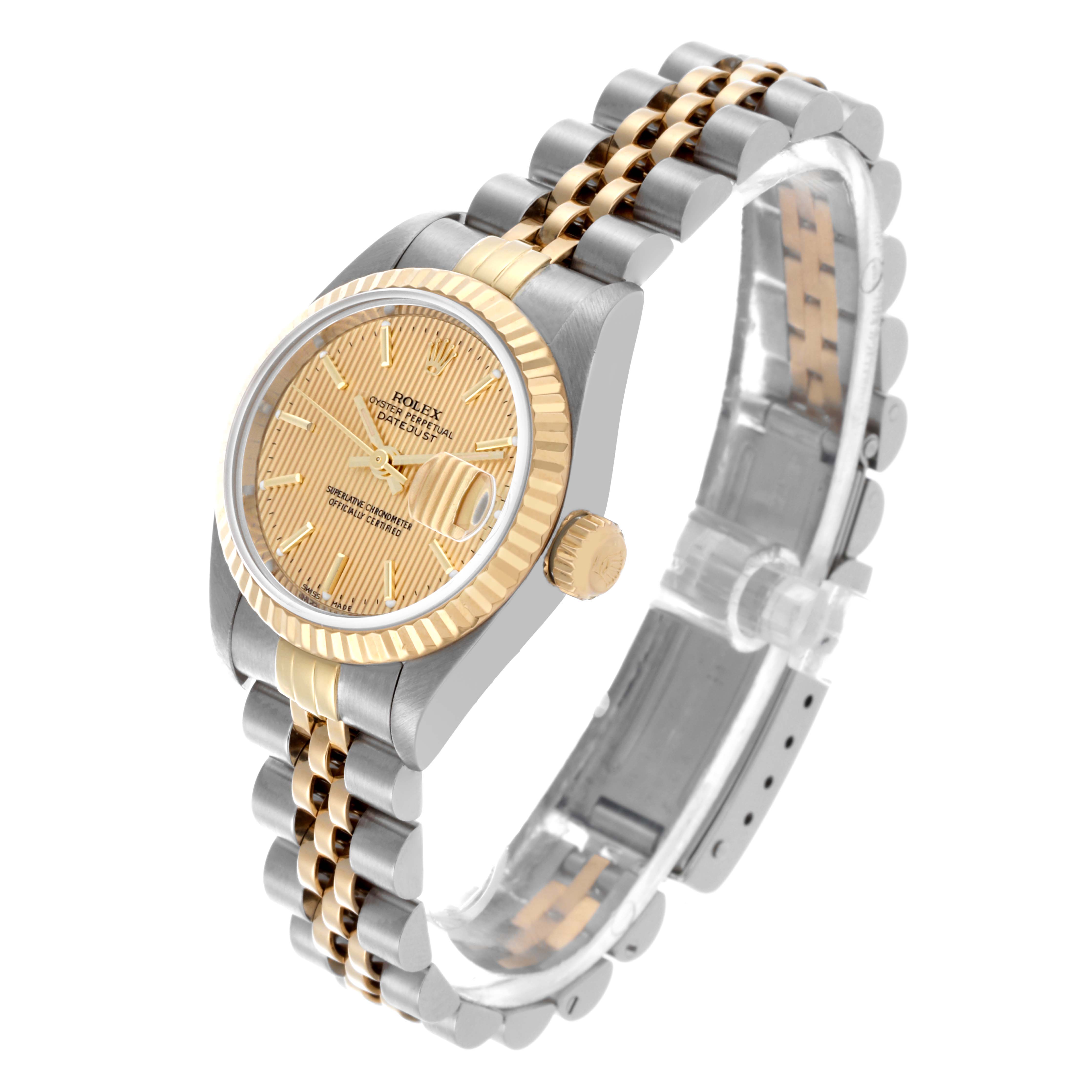 The Rolex Datejust 79173 Women's Steel and Gold (two tone) Champagne Dial 79173 Women's Steel and Gold (two tone) Champagne Dial watch is shown at a three-quarter angle, highlighting the face, bezel, crown, and two-tone bracelet.