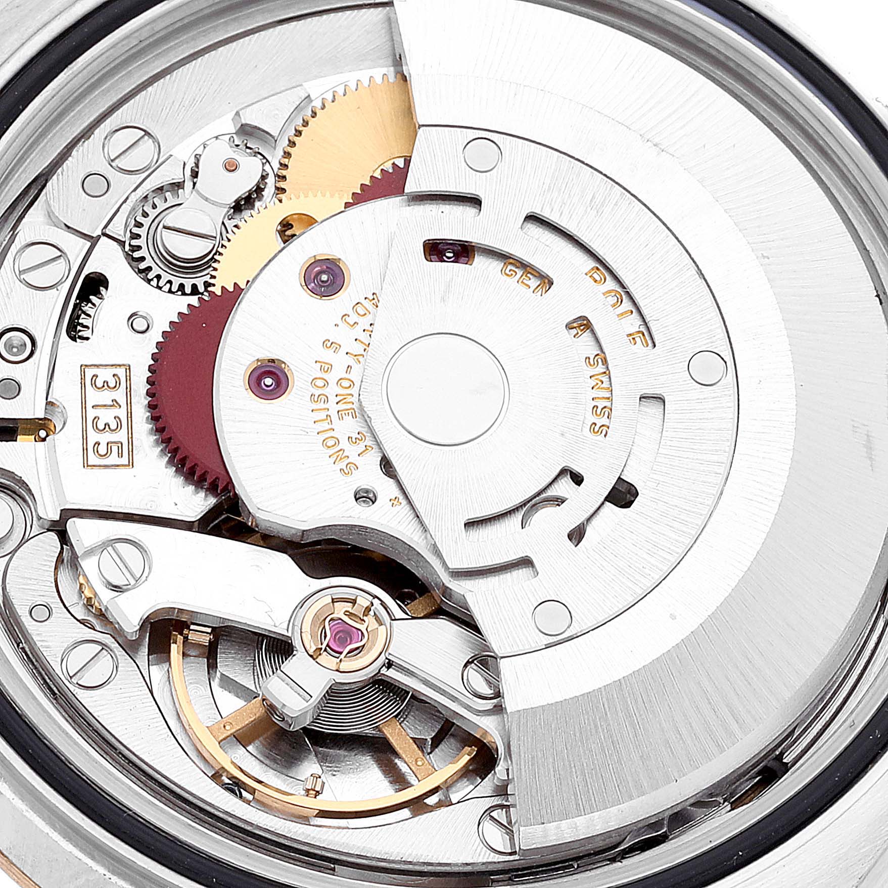 This image shows a close-up view of the movement mechanism of a Rolex Datejust 116233 Men's Steel and Gold (two tone) White Dial 116233 Men's Steel and Gold (two tone) White Dial watch.