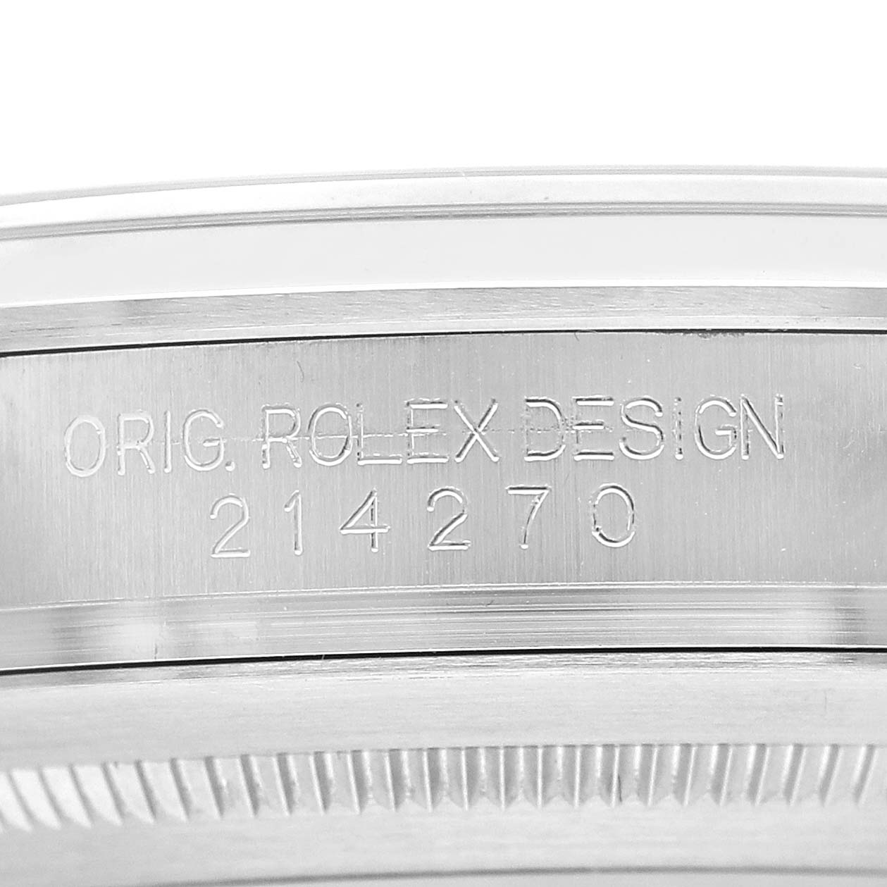 The image shows a close-up of the engraving on the side of a Rolex Explorer 214270 Men's Stainless Steel Black Dial watch case, displaying "ORIG. ROLEX DESIGN 214270".